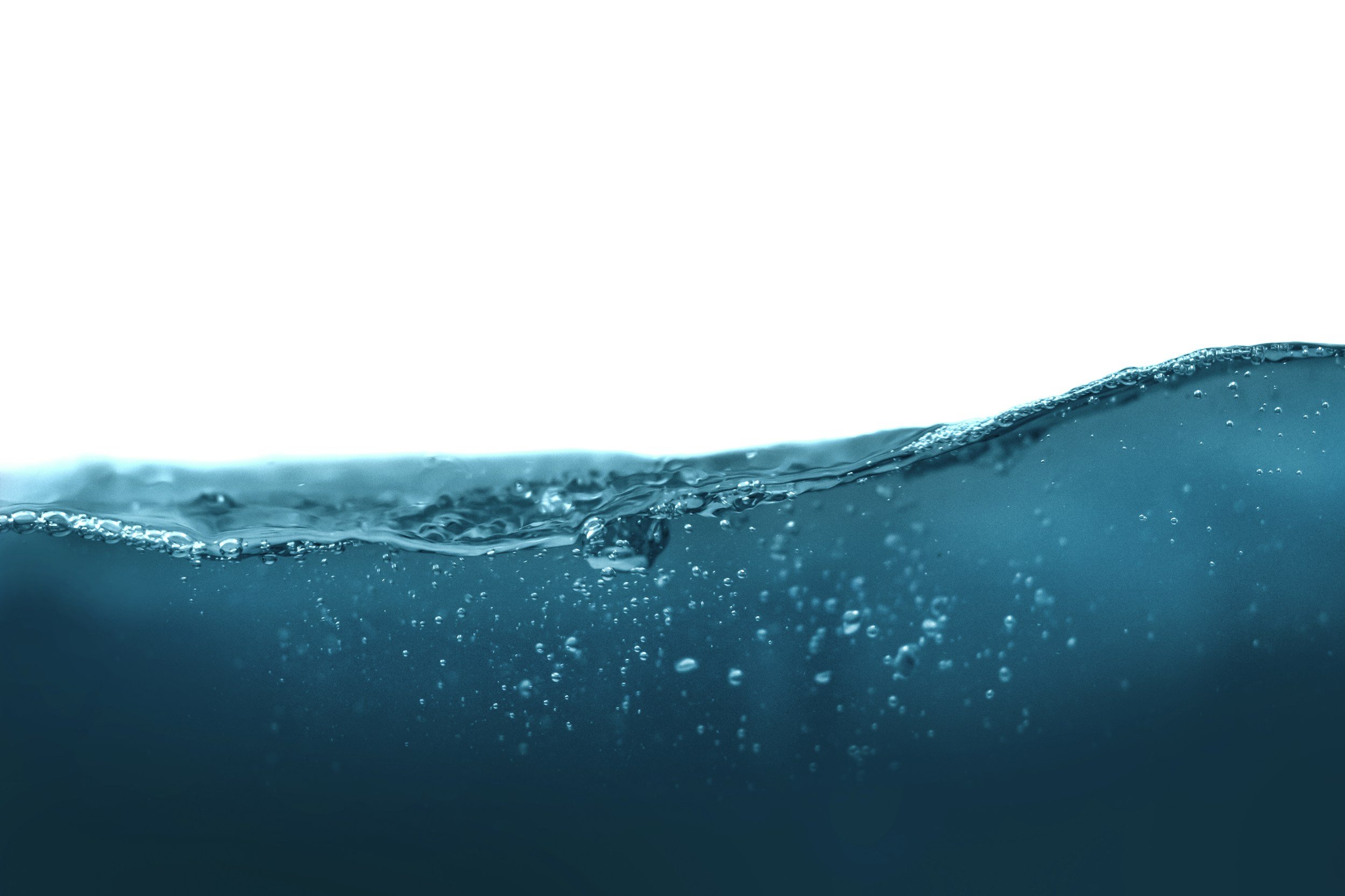 Close-up of water with bubbles and ripples, with a white background.
