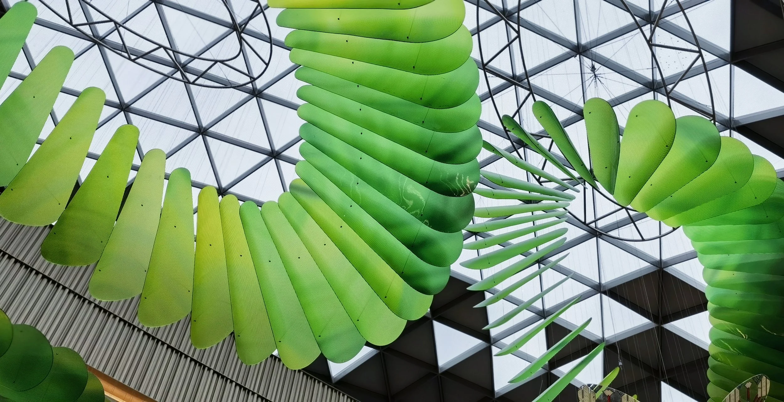 CDF Sanya International Duty-Free Complex large-scale art installation in stainless steel and copper brocade, design development, production, and installation by Core Art Strategies.