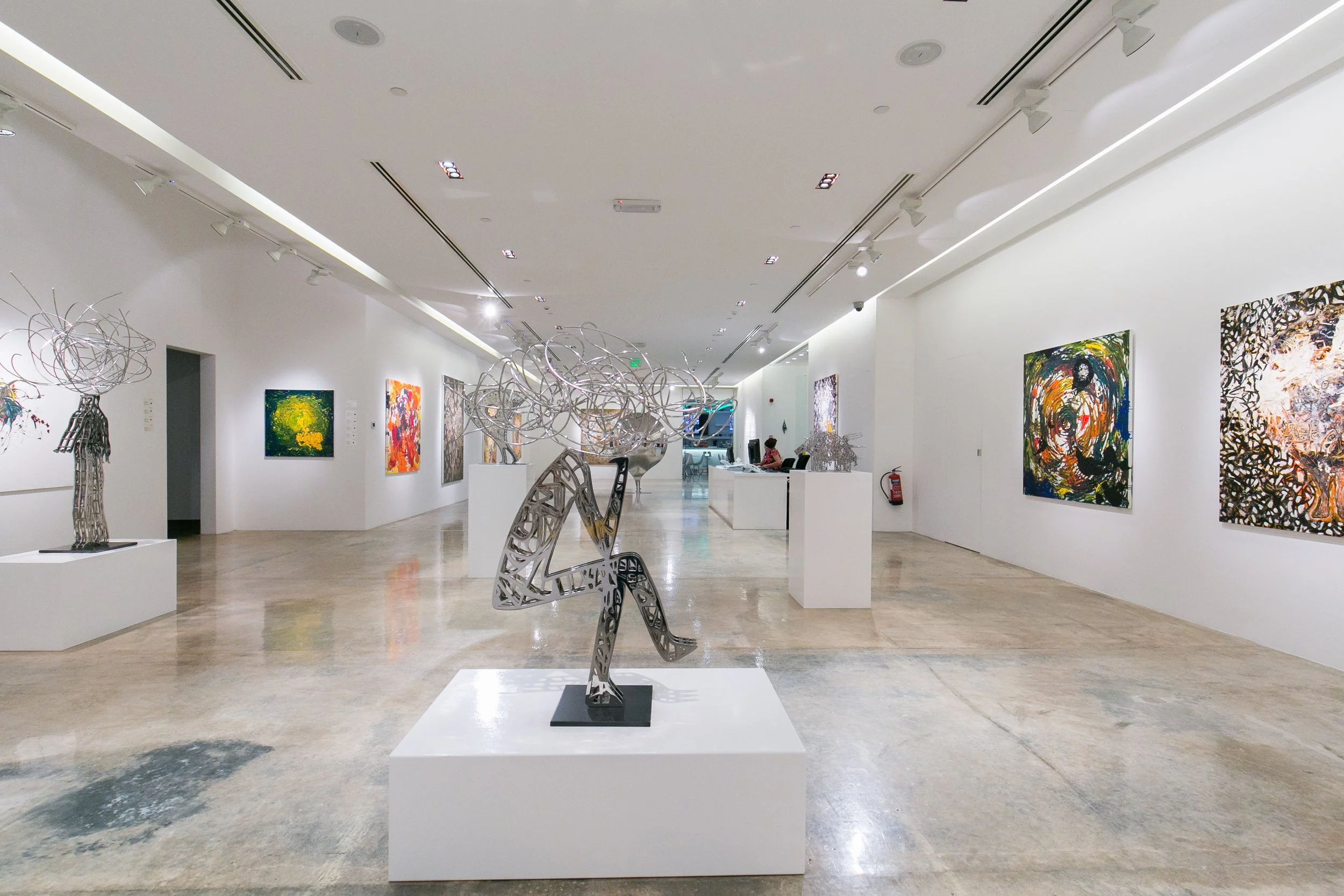 Audience engagement during a Nadim Karam exhibition in Qatar, reflecting the role of Core Art Strategies in contemporary art curation and exhibition development.