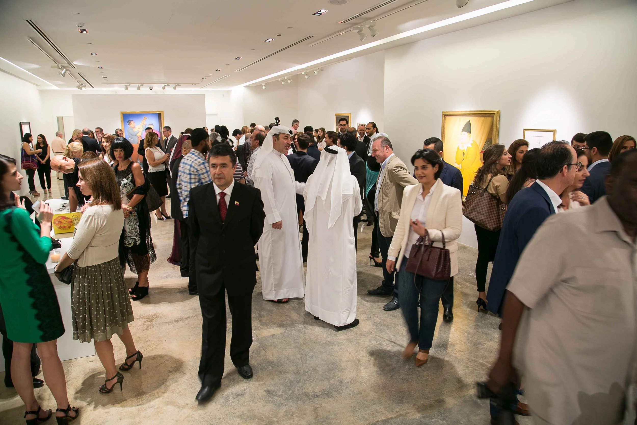 Visitors observing Fernando Botero paintings in an exhibition curated by Mohamad Ali Makouk at Anima Gallery