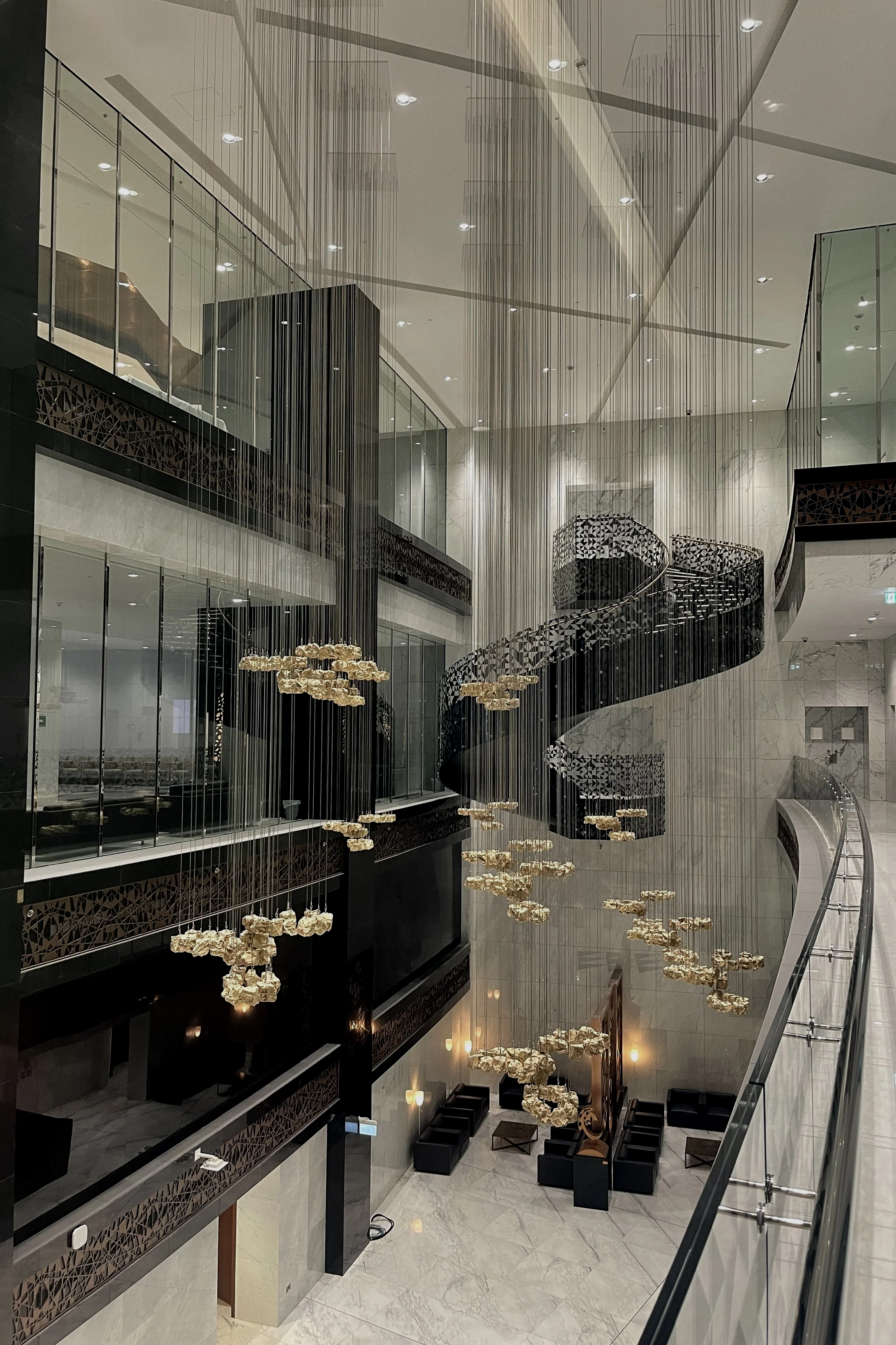 Large-scale architectural art installation at QatarEnergy Tower 10 headquarters delivered by Core Art Strategies as part of a corporate art strategy.