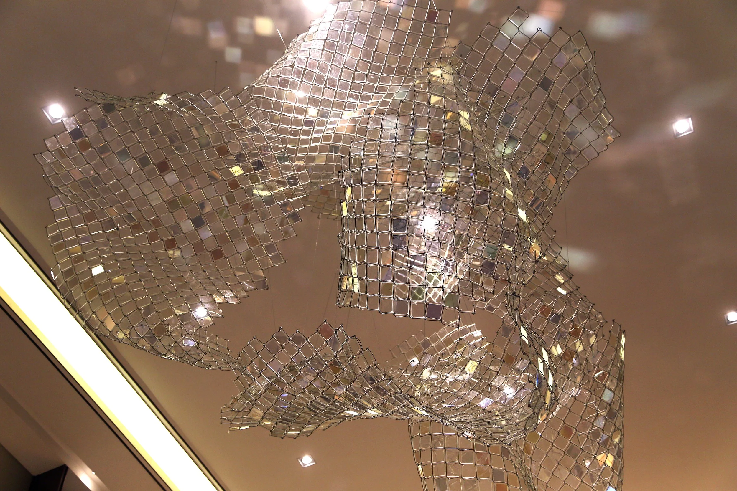 Zhenjiang Sales Center art installation in glass and stainless steel, delivered through design development, production, and installation by Core Art Strategies.