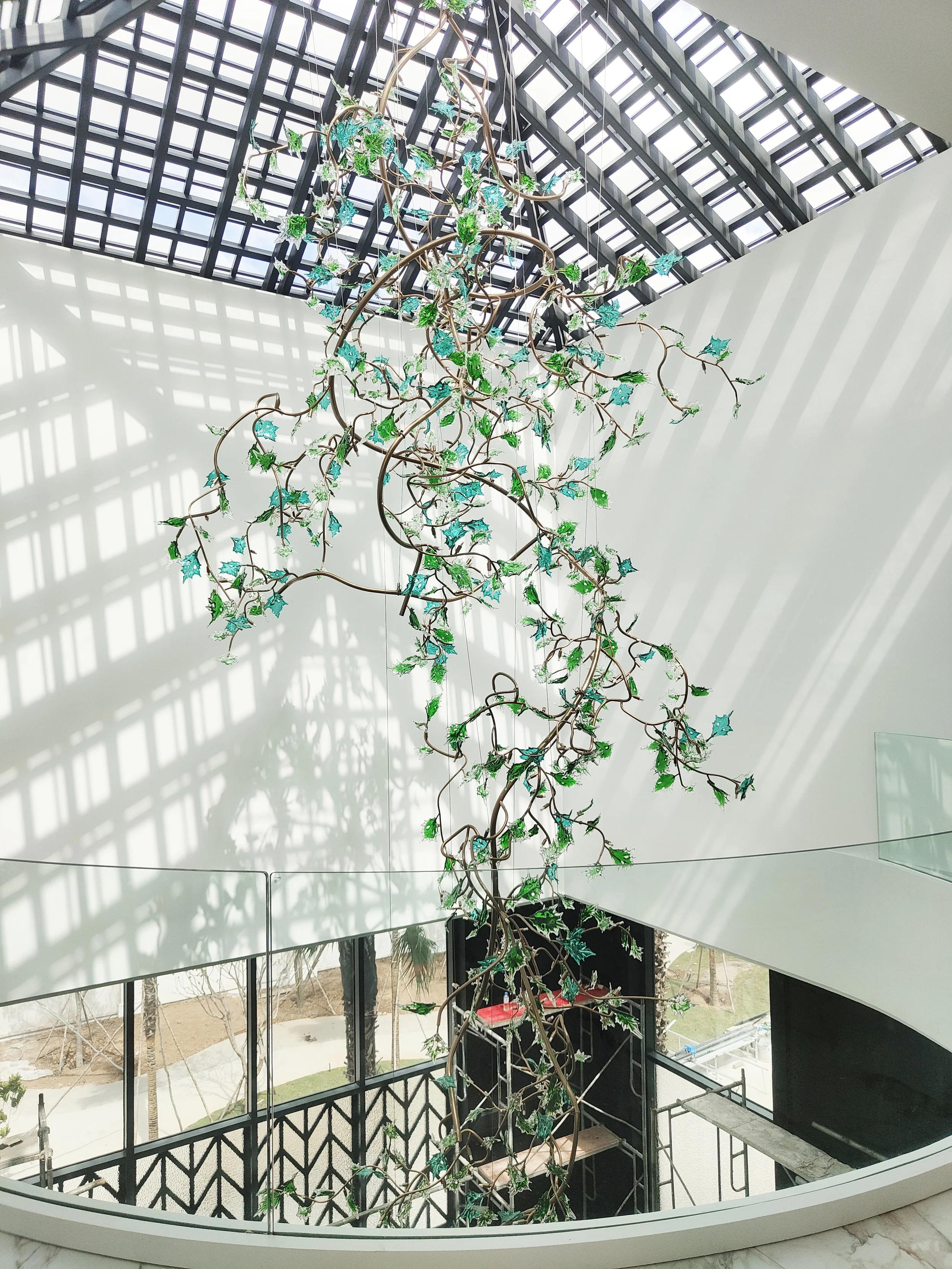 Private residence Hong Kong glass tree branch art installation, delivered through design development, production, and installation by Core Art Strategies.