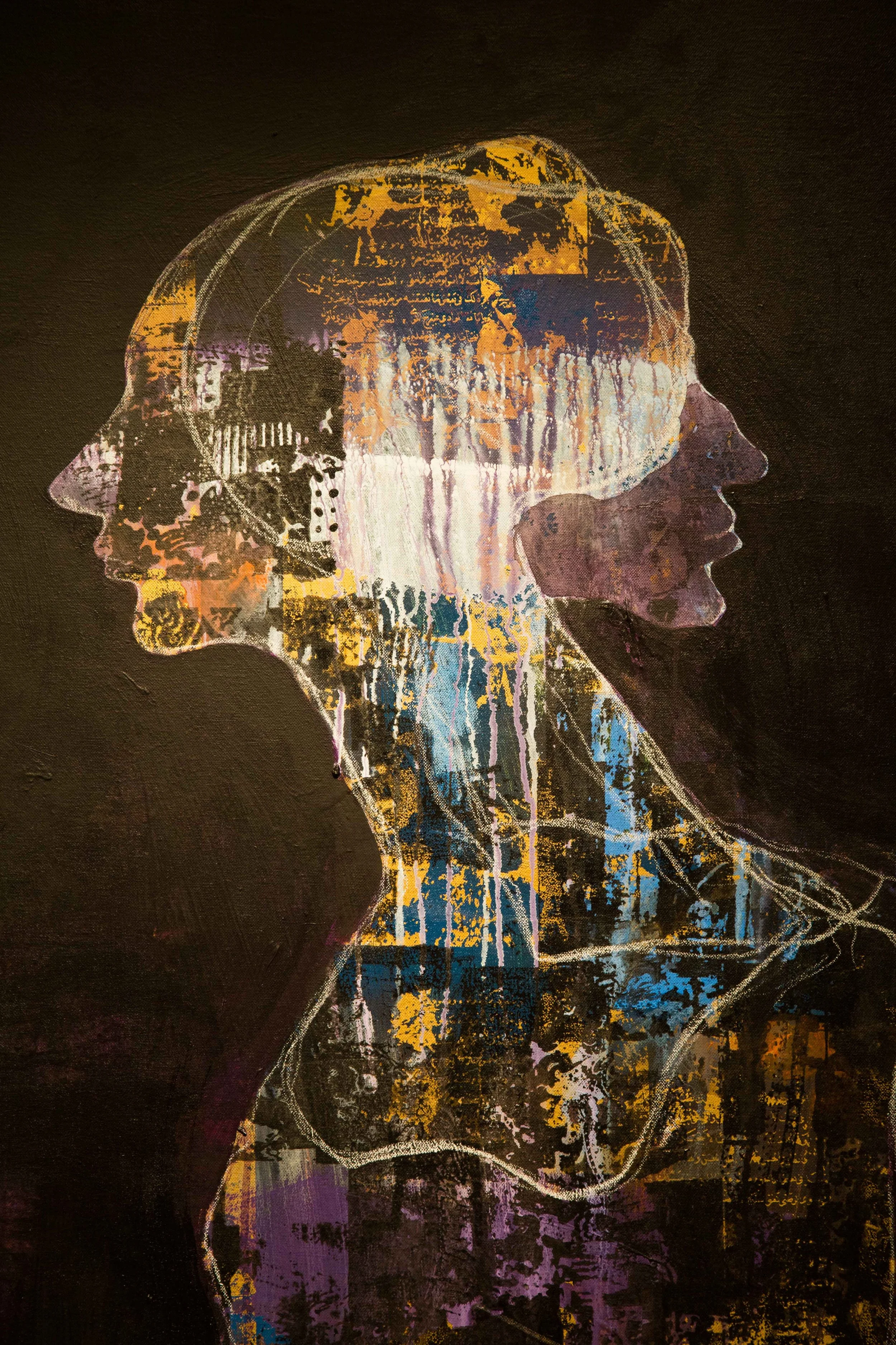 Abstract painting of a woman’s profile with layered, colorful textures on a dark background.
