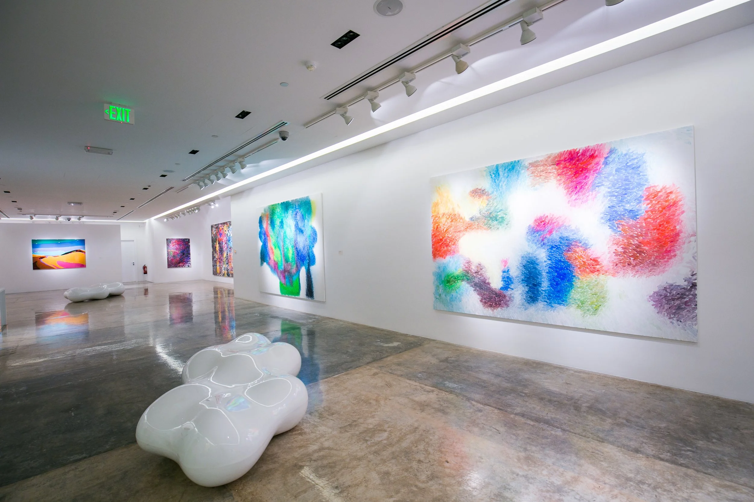Visitors’ perspective of a Peter Zimmermann exhibition in Qatar, where abstract painting and curated spatial flow define the contemporary art experience.