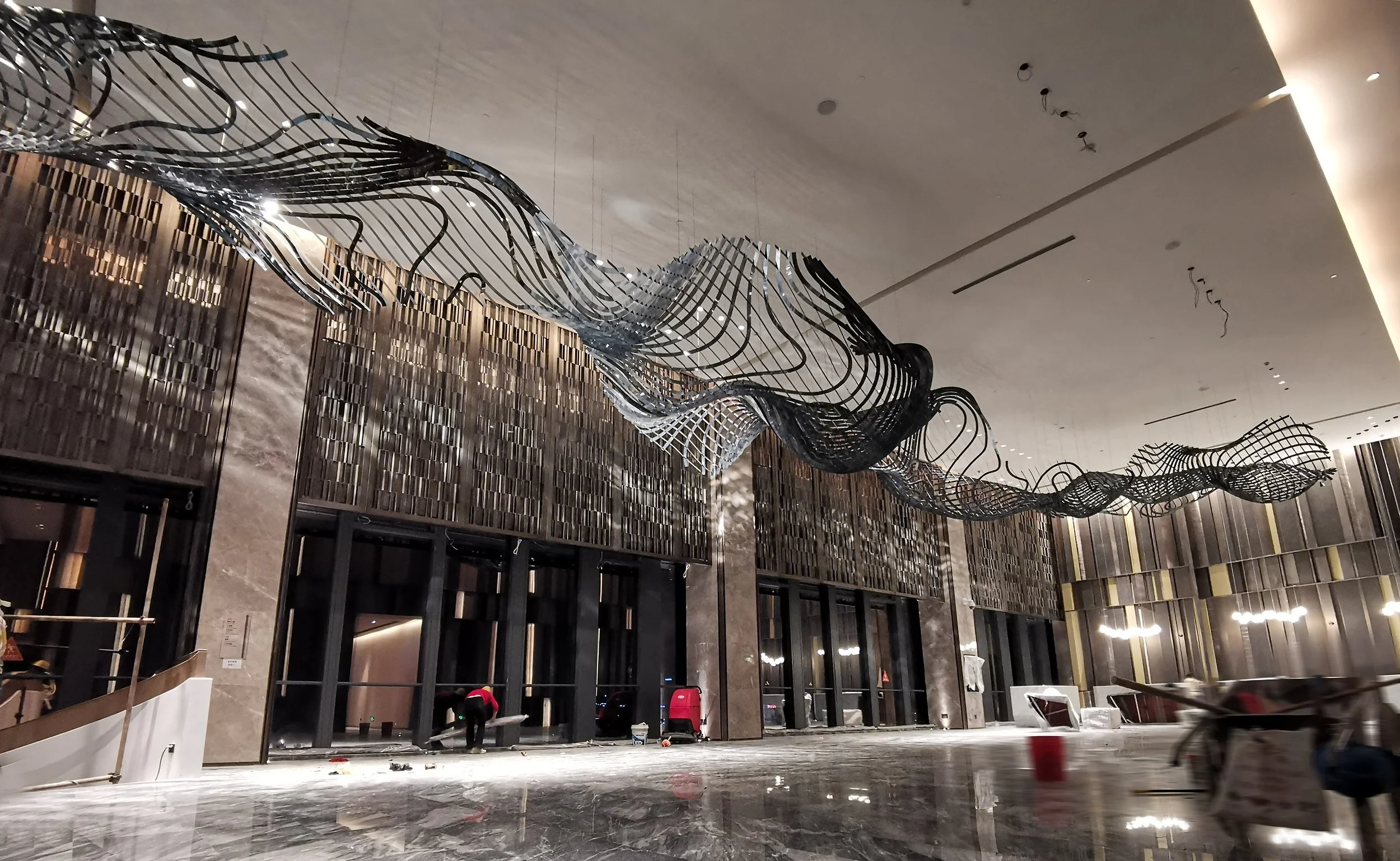 Chongqing Liangjiang Hi-Tech Hilton Hotel international five-star art installation, delivered through design development, production, and installation by Core Art Strategies.