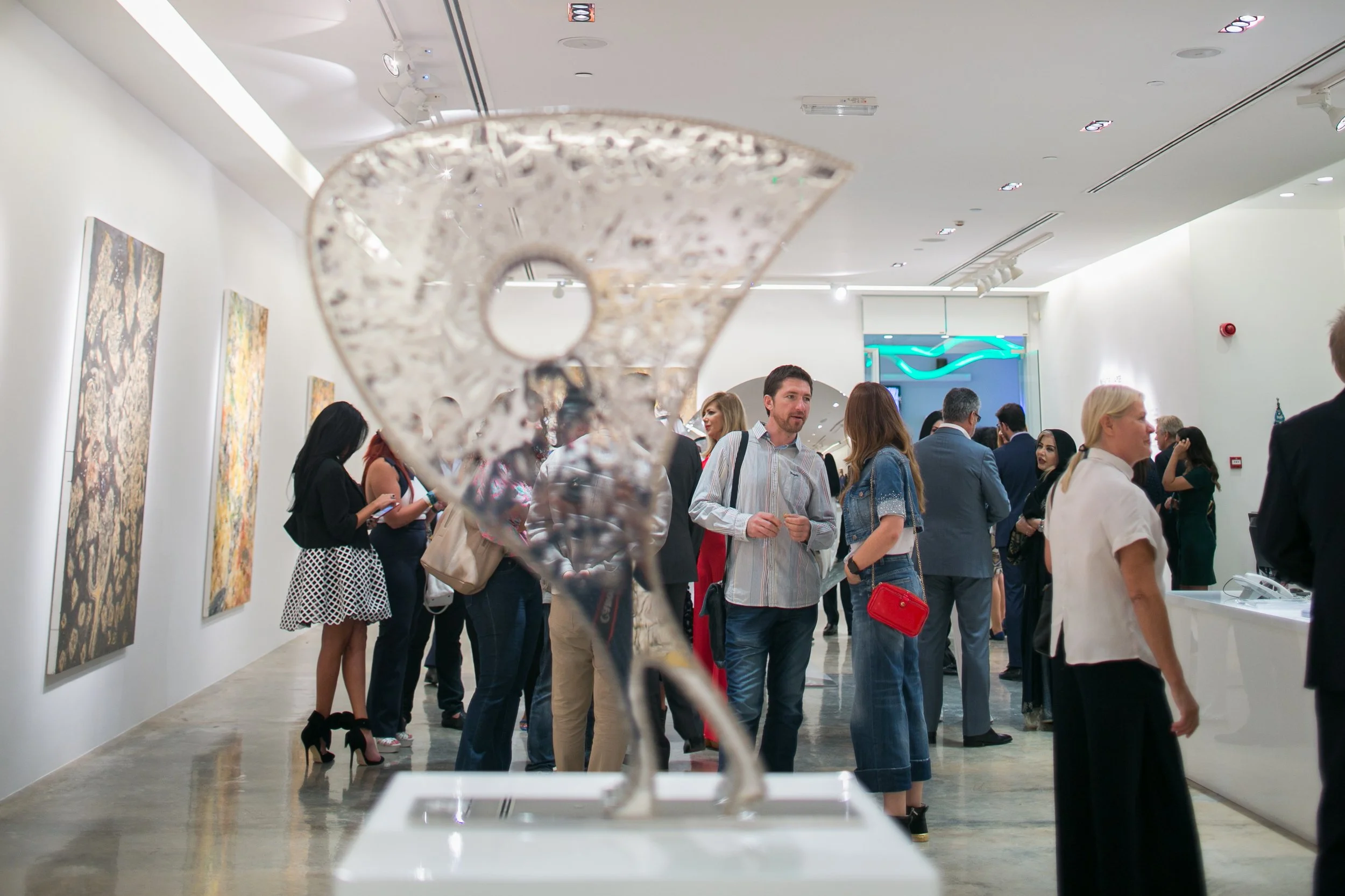 Visitors at a Nadim Karam solo exhibition in Qatar, reflecting Core Art Strategies’ approach to contemporary art curation, exhibition planning, and audience experience.