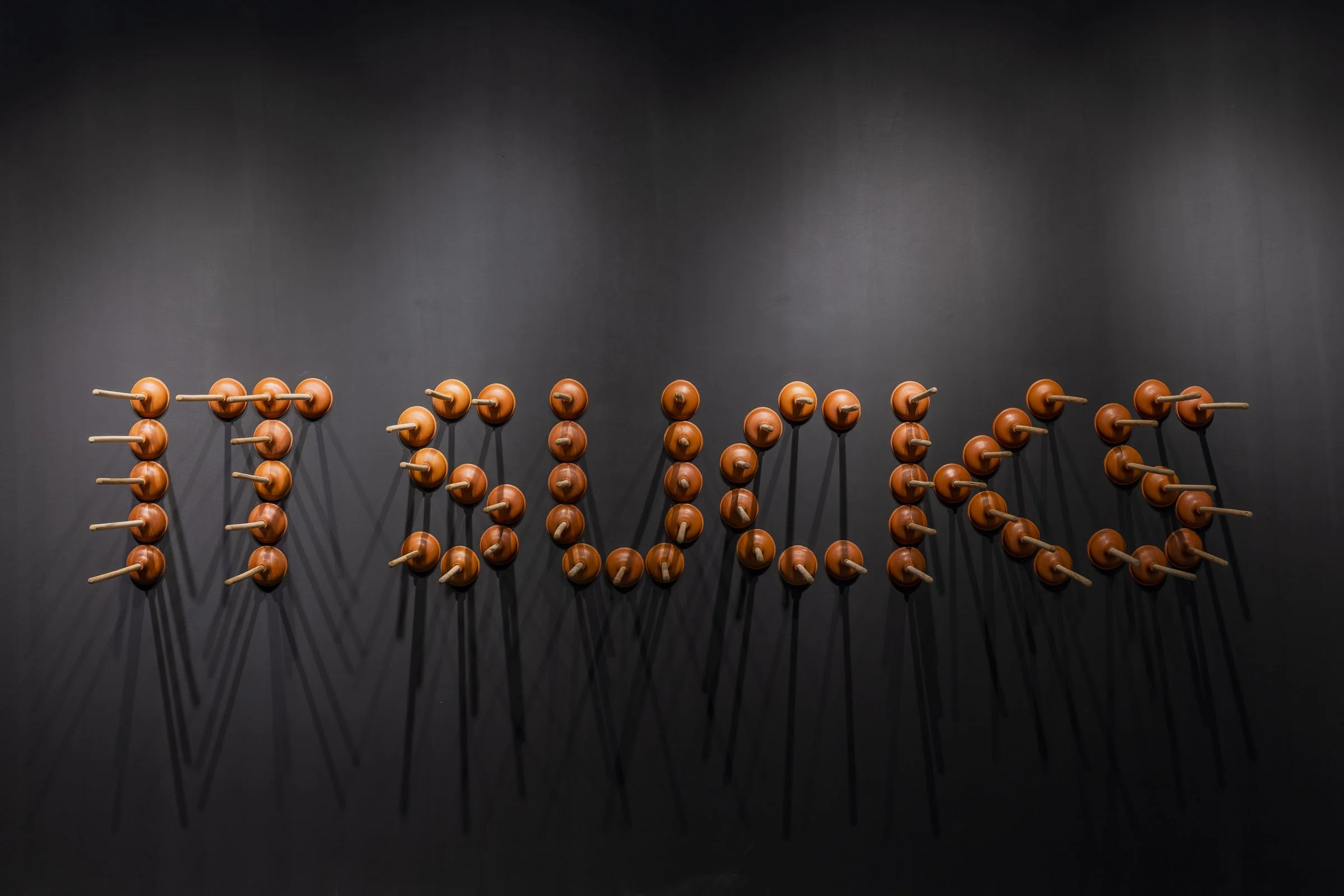 Eruption exhibition featuring works by Mahmoud Obaidi Plunger installation curated by Mohamad Ali Makouk for Core Art Strategies art consultancy