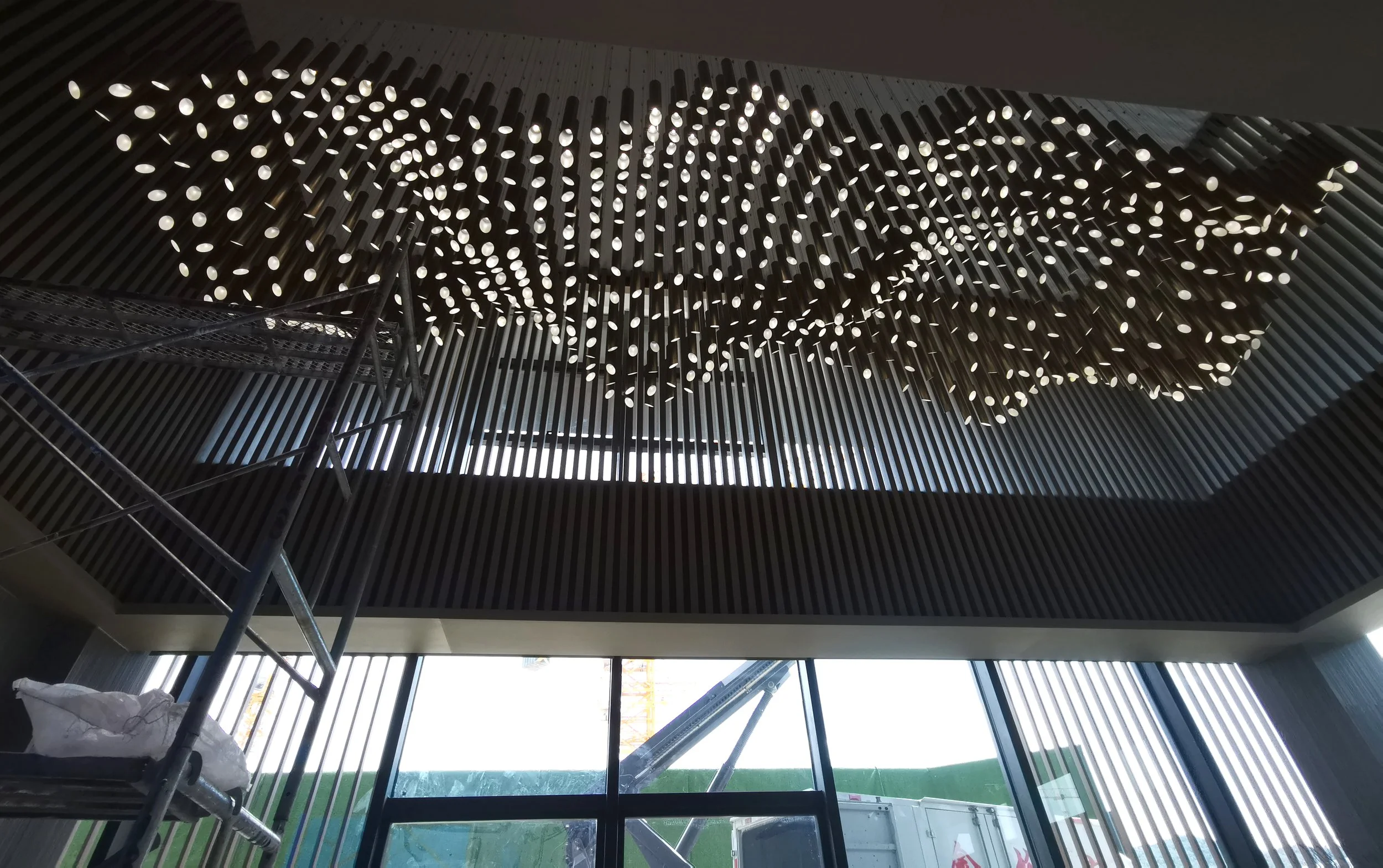 Private residence Beirut art installation in stainless steel with reflective panels and LED lighting, delivered through design development, production, and installation by Core Art Strategies.