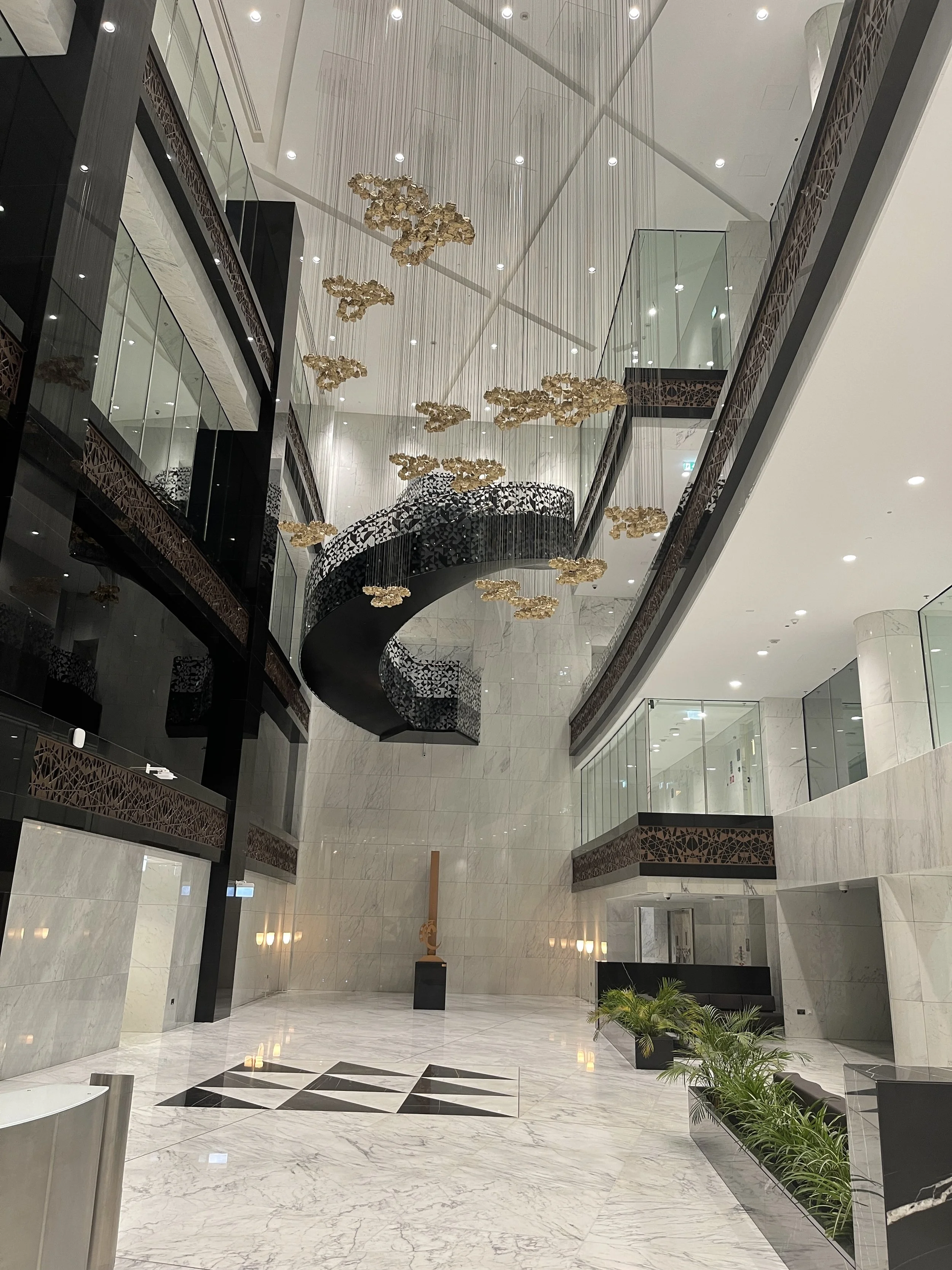 Large-scale architectural art installation at QatarEnergy Tower 10 headquarters delivered by Core Art Strategies as part of a corporate art strategy.