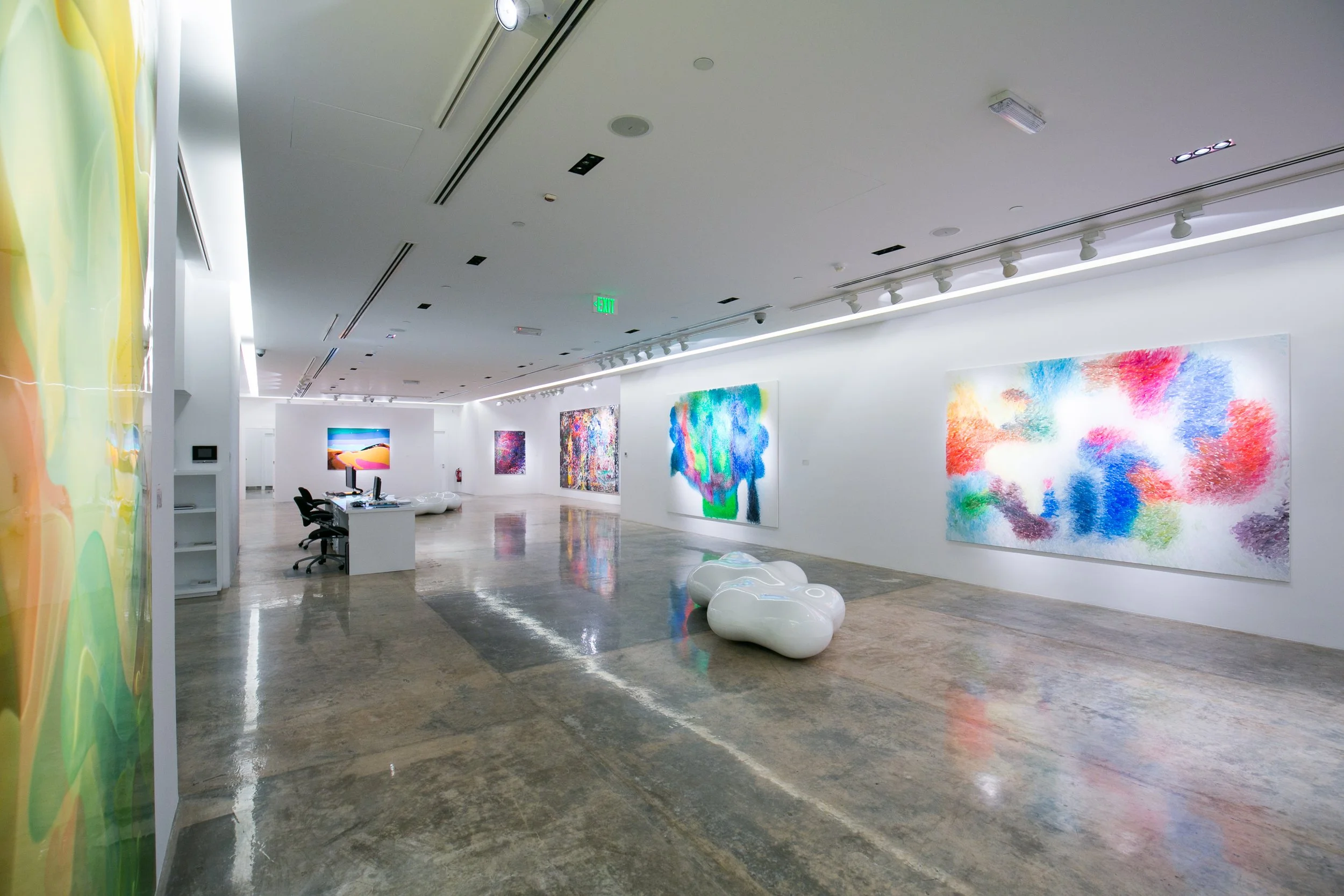 A contemporary gallery scene from Peter Zimmermann’s exhibition in Qatar, emphasizing color, scale, and exhibition design by Mohamad Makouk for Core Art Strategies.