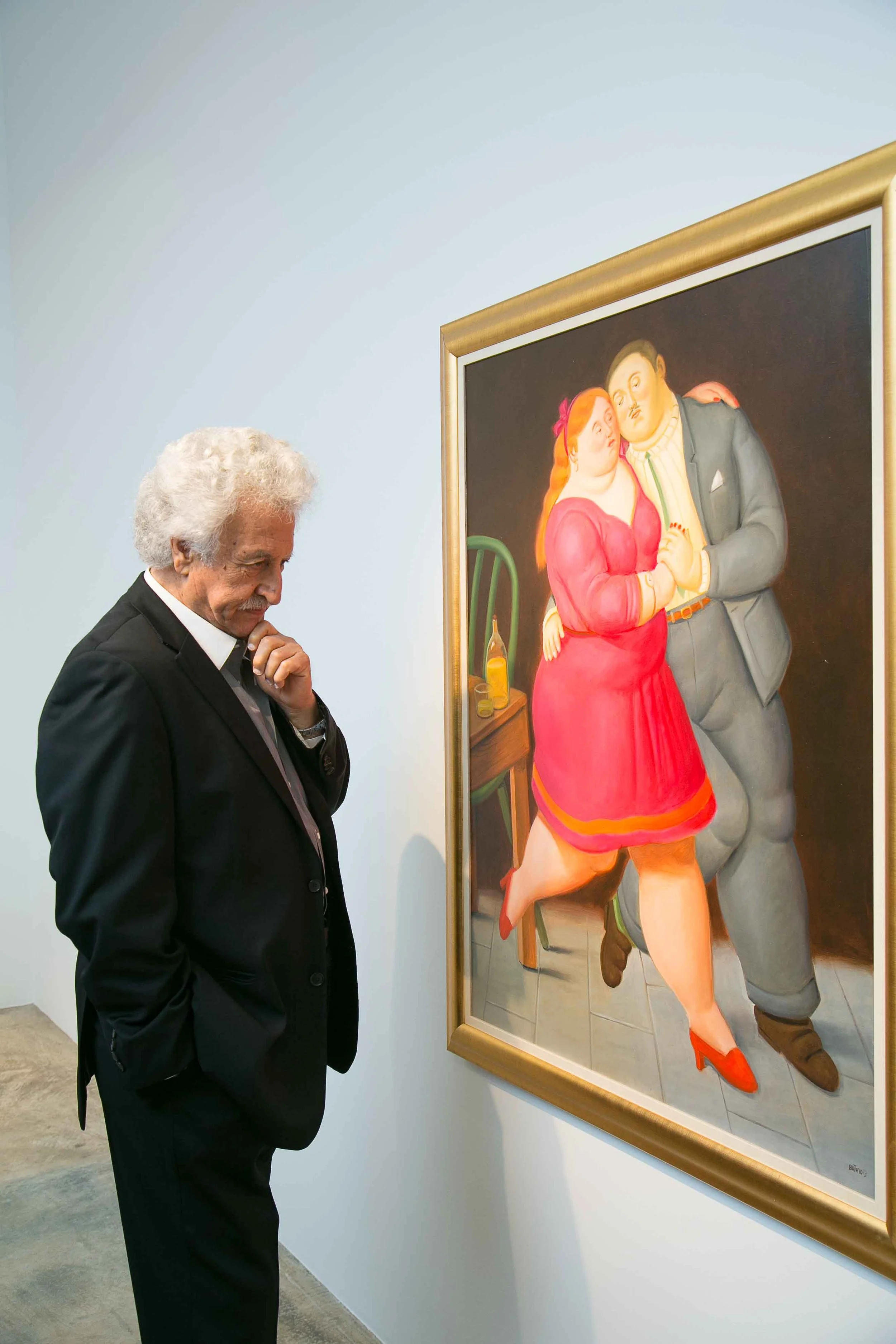 Visitors experiencing a Fernando Botero exhibition curated by Mohamad Ali Makouk in Qatar