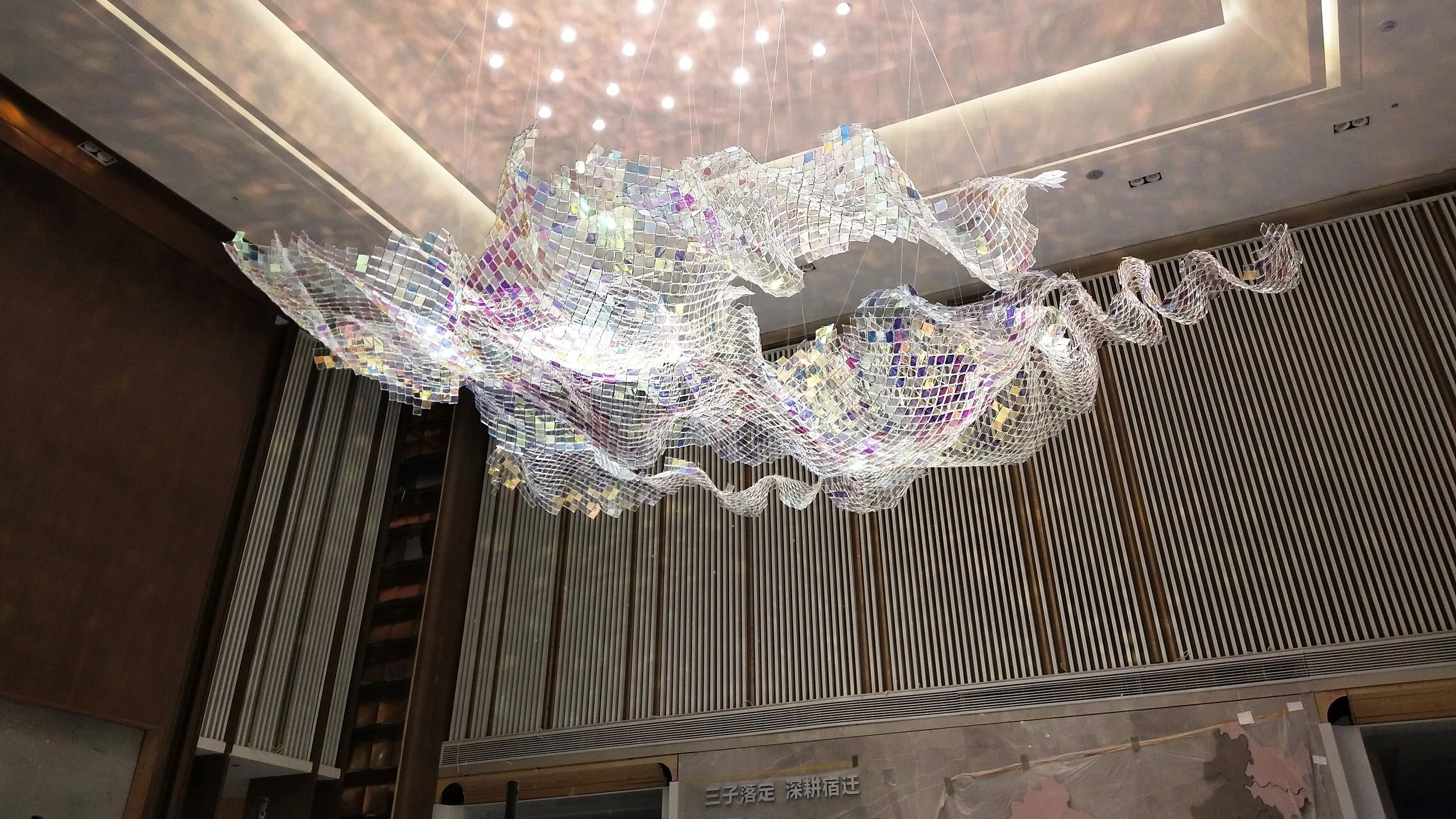 Wuxi Sales Center art installation in glass and stainless steel, delivered through design development, production, and installation by Core Art Strategies.