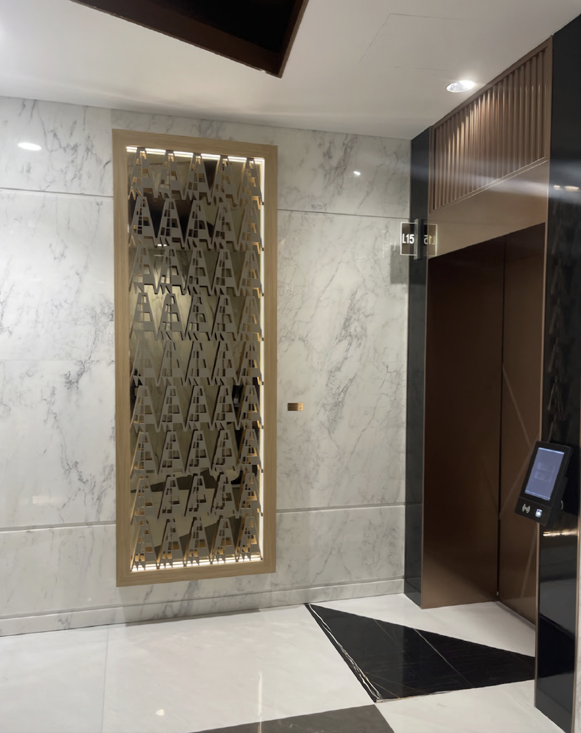 Wall-mounted artwork by Qatari artist Aisha Al-Suwaidi installed as part of the corporate art program curated by Core Art Strategies for QatarEnergy headquarters.