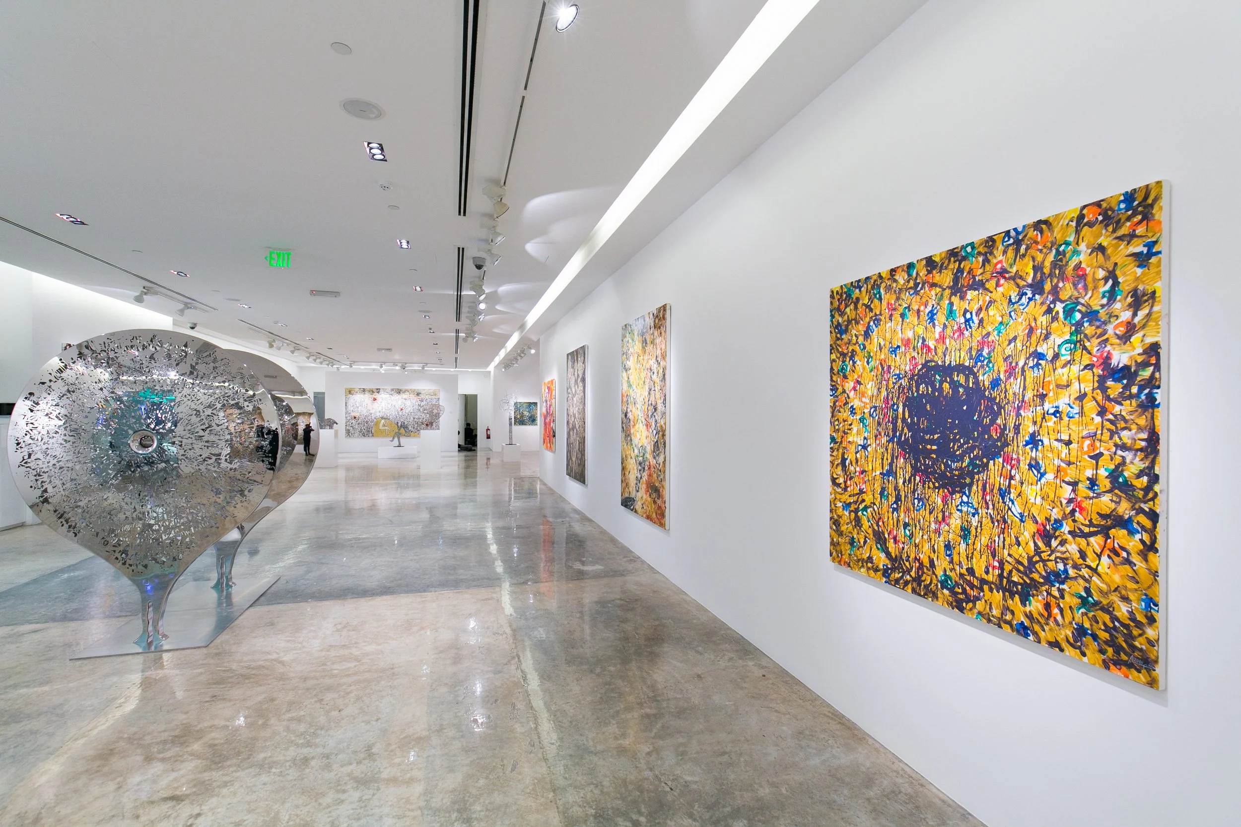 Installation and opening view of a Nadim Karam exhibition in Qatar, curated by Mohamad Makouk for Core Art Strategies, showcasing contemporary art in a gallery setting.