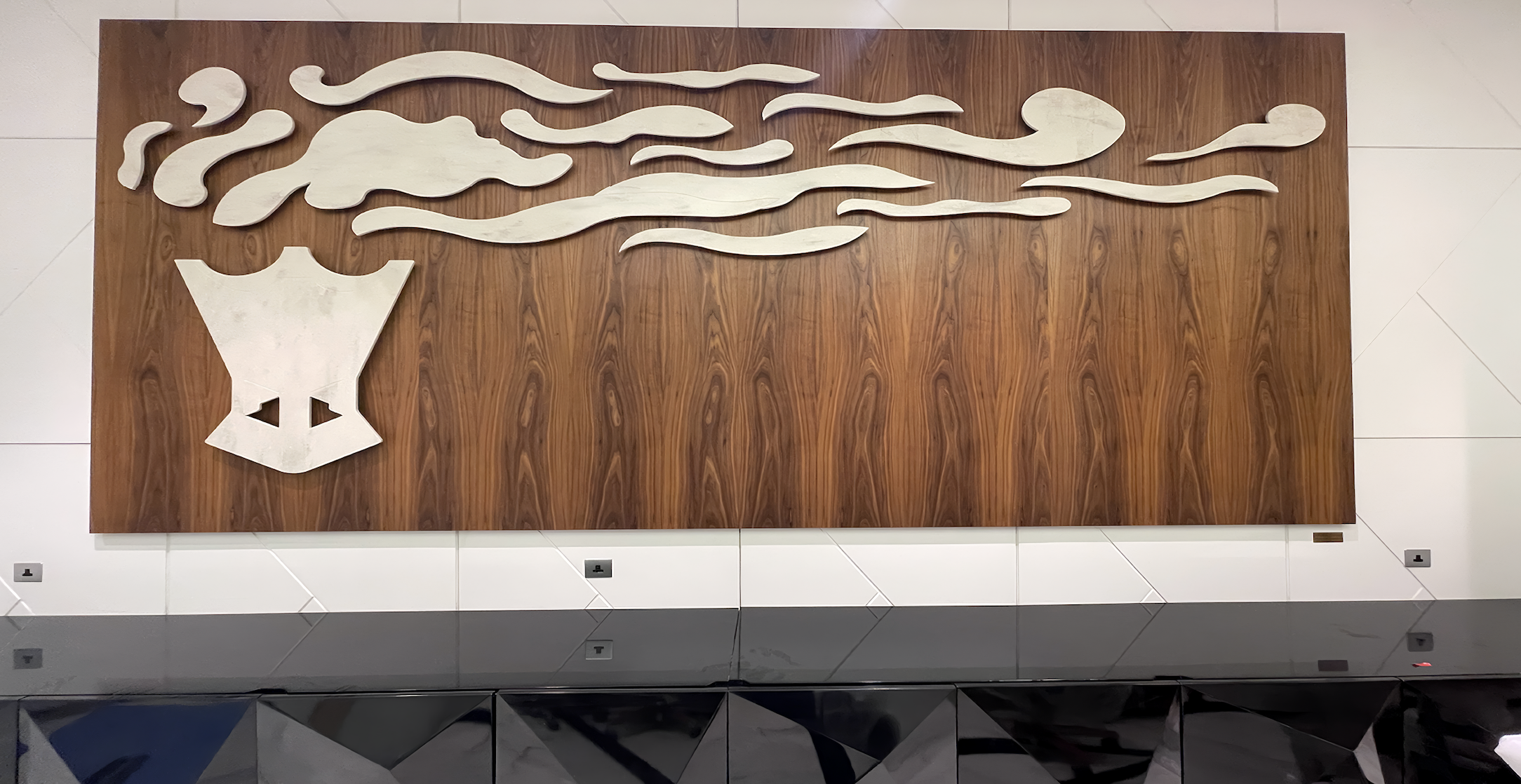 Wall-mounted artwork by Qatari artist Aisha Al-Suwaidi installed as part of the corporate art program curated by Core Art Strategies for QatarEnergy headquarters.