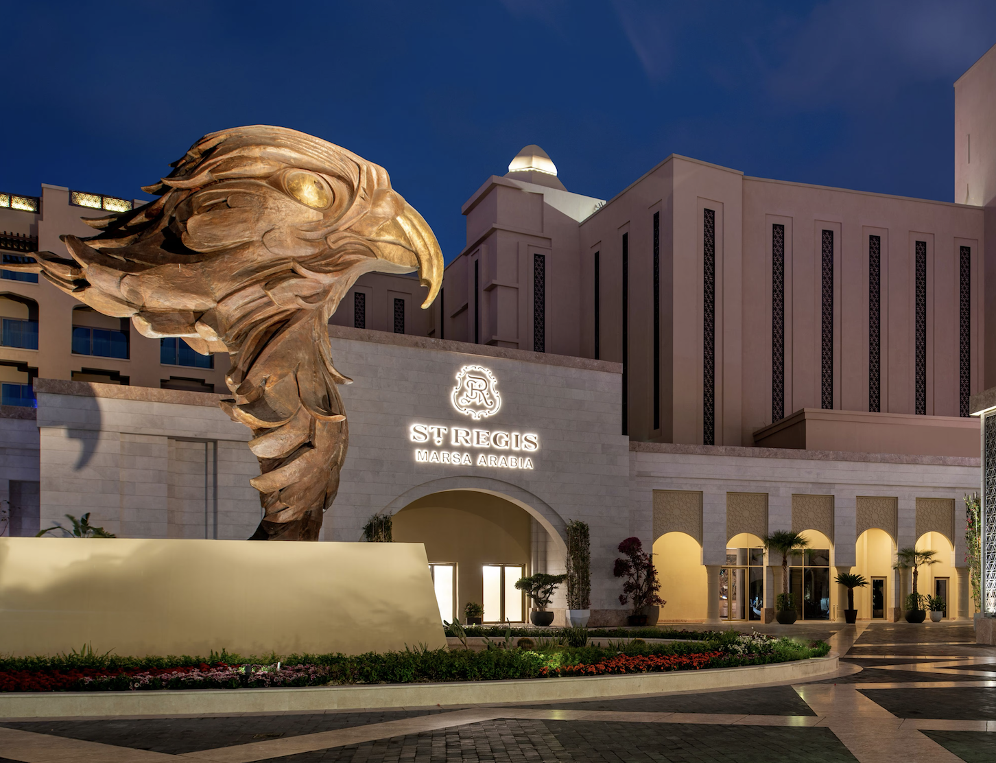Large bronze Arabian hawk sculpture installed at St. Regis Marsa Arabia Private Island, Doha as part of the curated art program developed by Core Art Strategies.