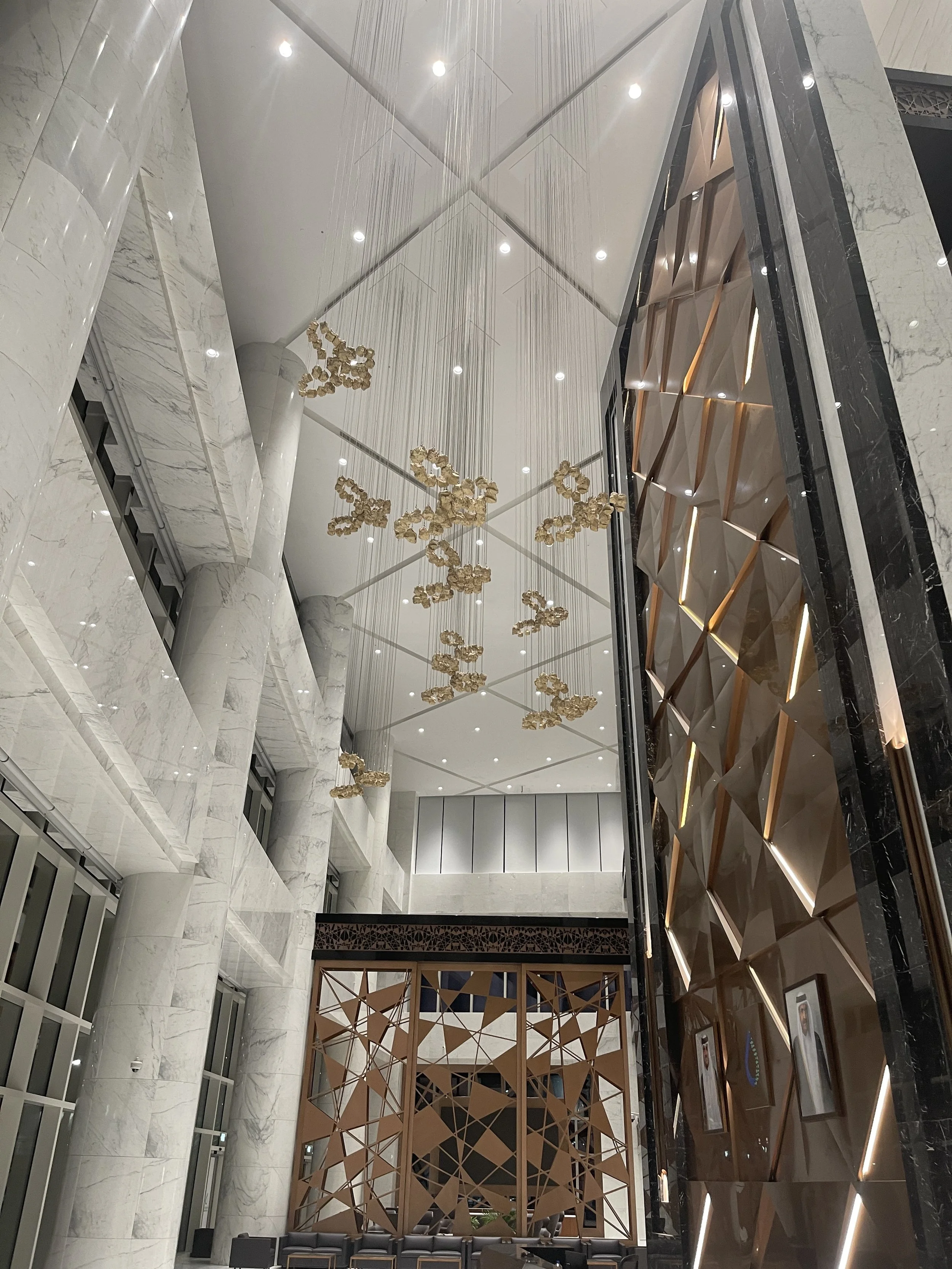 Large-scale architectural art installation at QatarEnergy Tower 10 headquarters delivered by Core Art Strategies as part of a corporate art strategy.