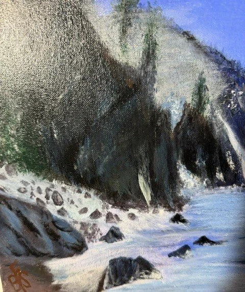 Close-up detail of the mountains, evergreen trees, rocky shoreline, and textured brushwork in Alpine Stillness by Bonnie Seide.