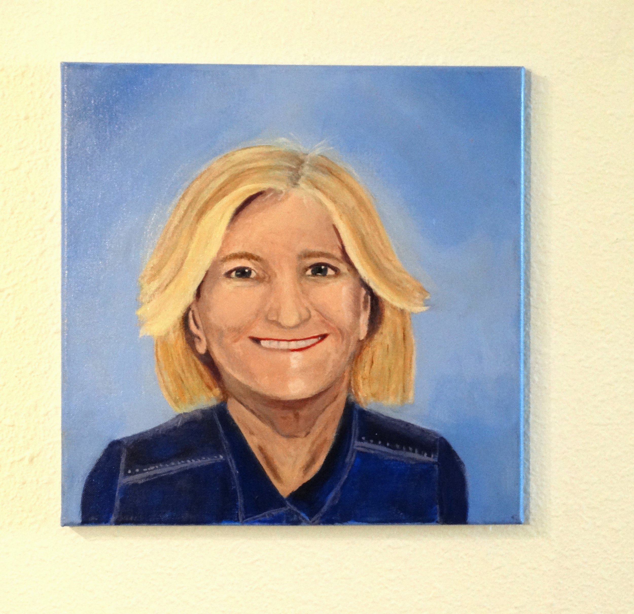 Becoming, a 14 x 14 original acrylic self-portrait by Bonnie Seide, displayed on a wall.