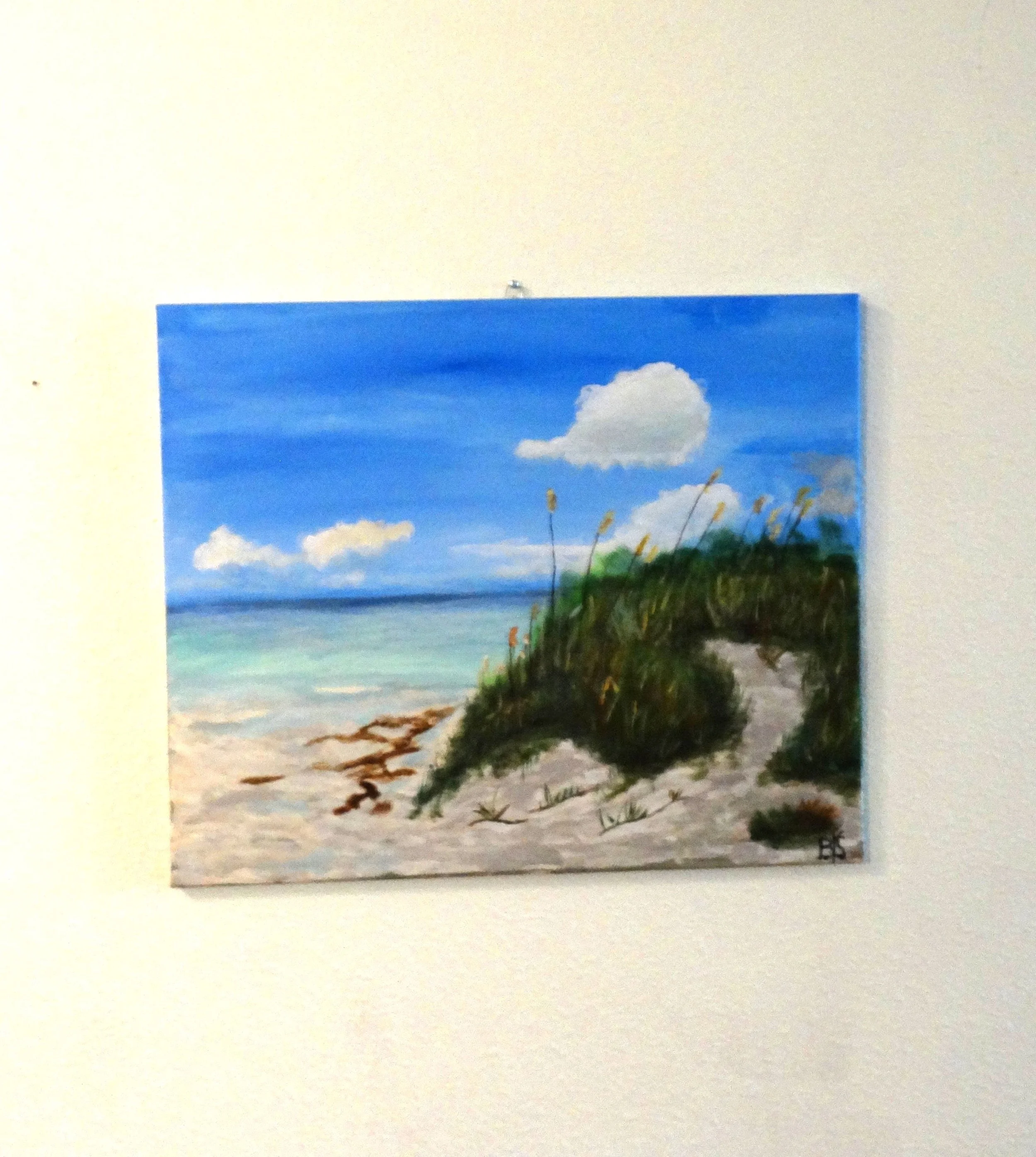 Invitation to the Shore, a 20 x 24 original acrylic coastal painting by Bonnie Seide, displayed on a wall.