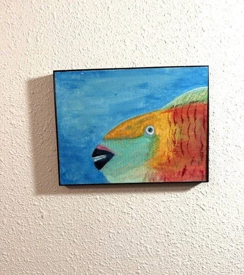 Reef Personality, a 9 x 12 original acrylic parrotfish paintibng by Bonnie Seide on canvas panel, displayed on a wall.