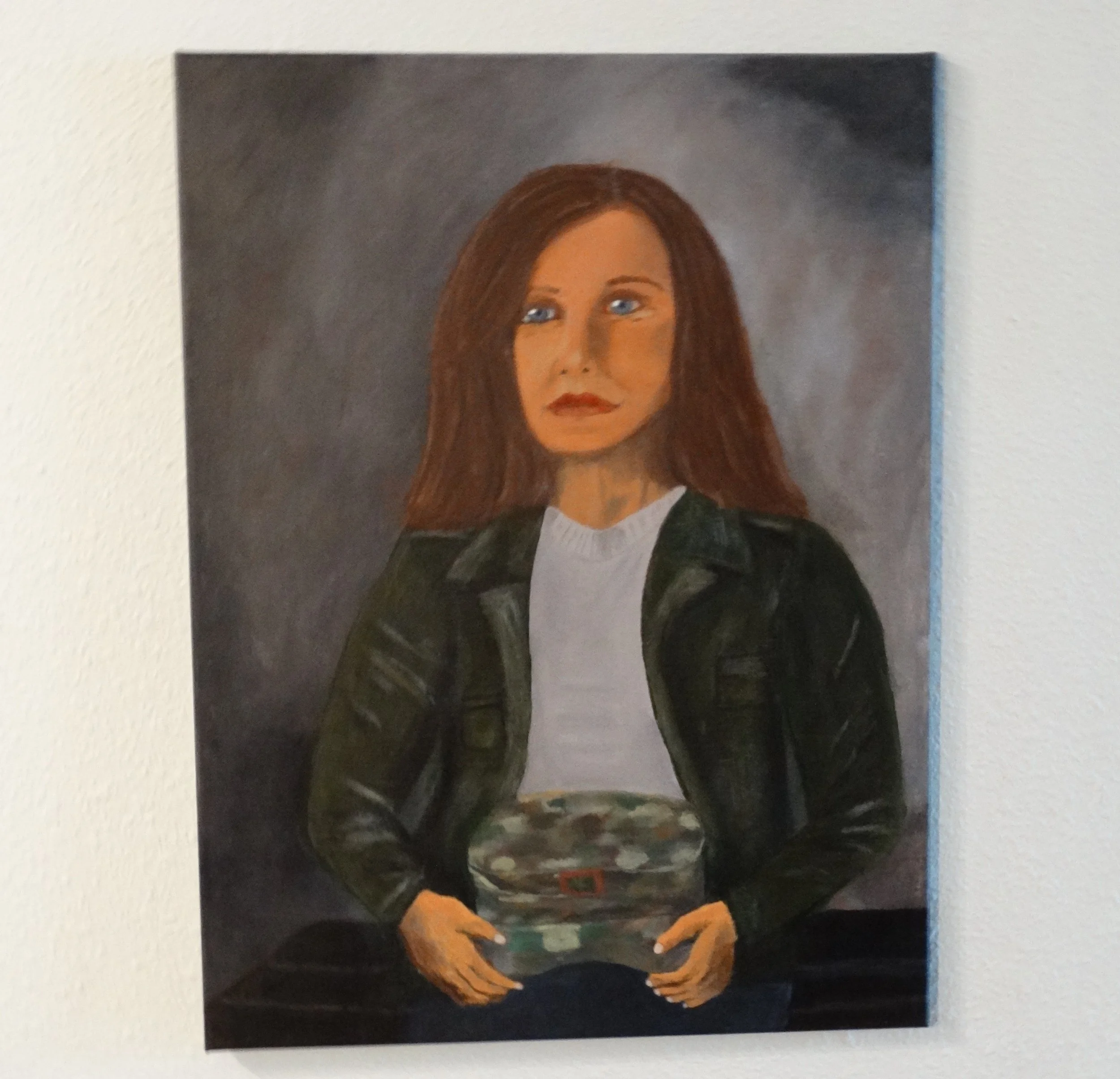 Maria: The Strength She Carries, an 18 x 24 original acrylic portrait by Bonnie Seide displayed on a wall