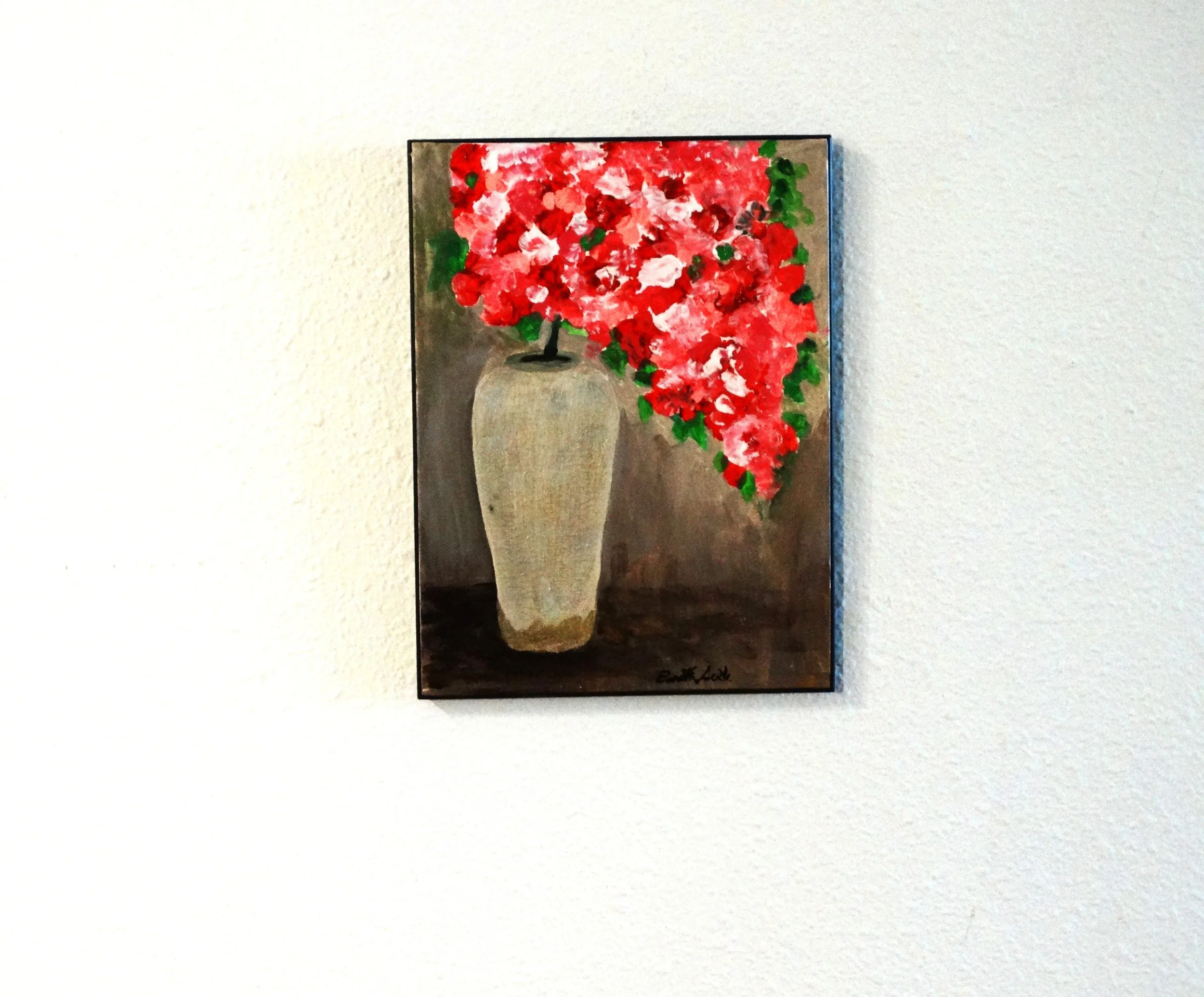Abundant Bloom, an 8 x 10 original acrylic floral painting by Bonnie Seide, displayed on a  wall.