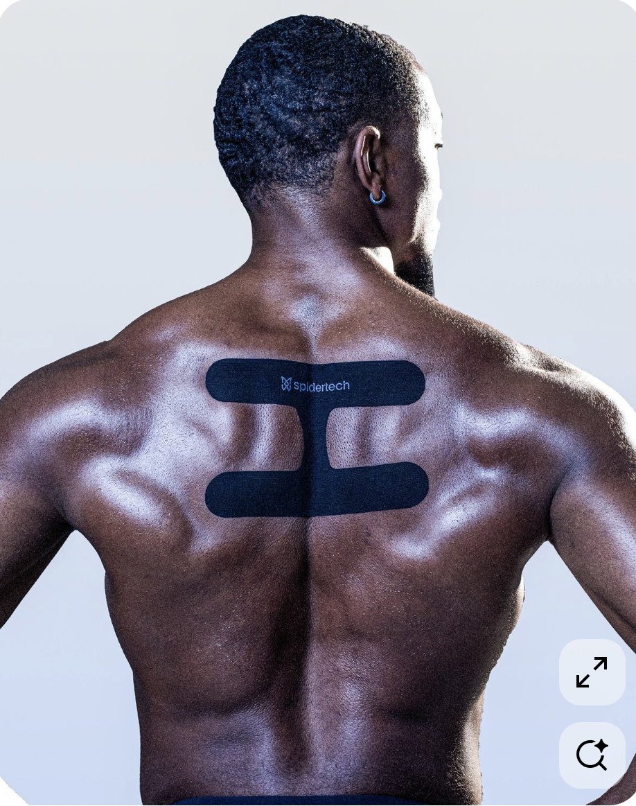A shirtless man with Kinesiology tape.