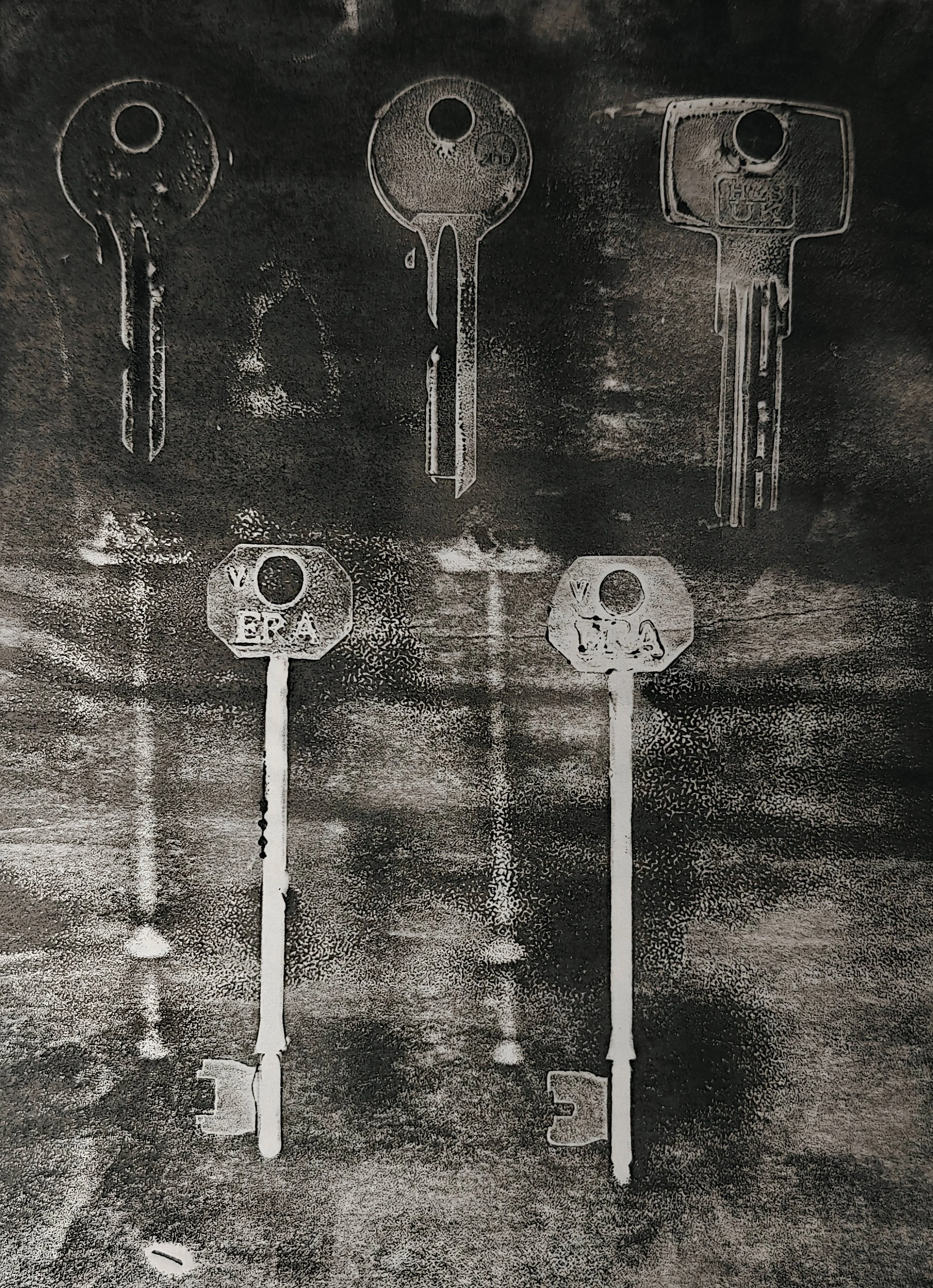 Artwork by Shaun Bell featuring a black and white faded print of organised keys.