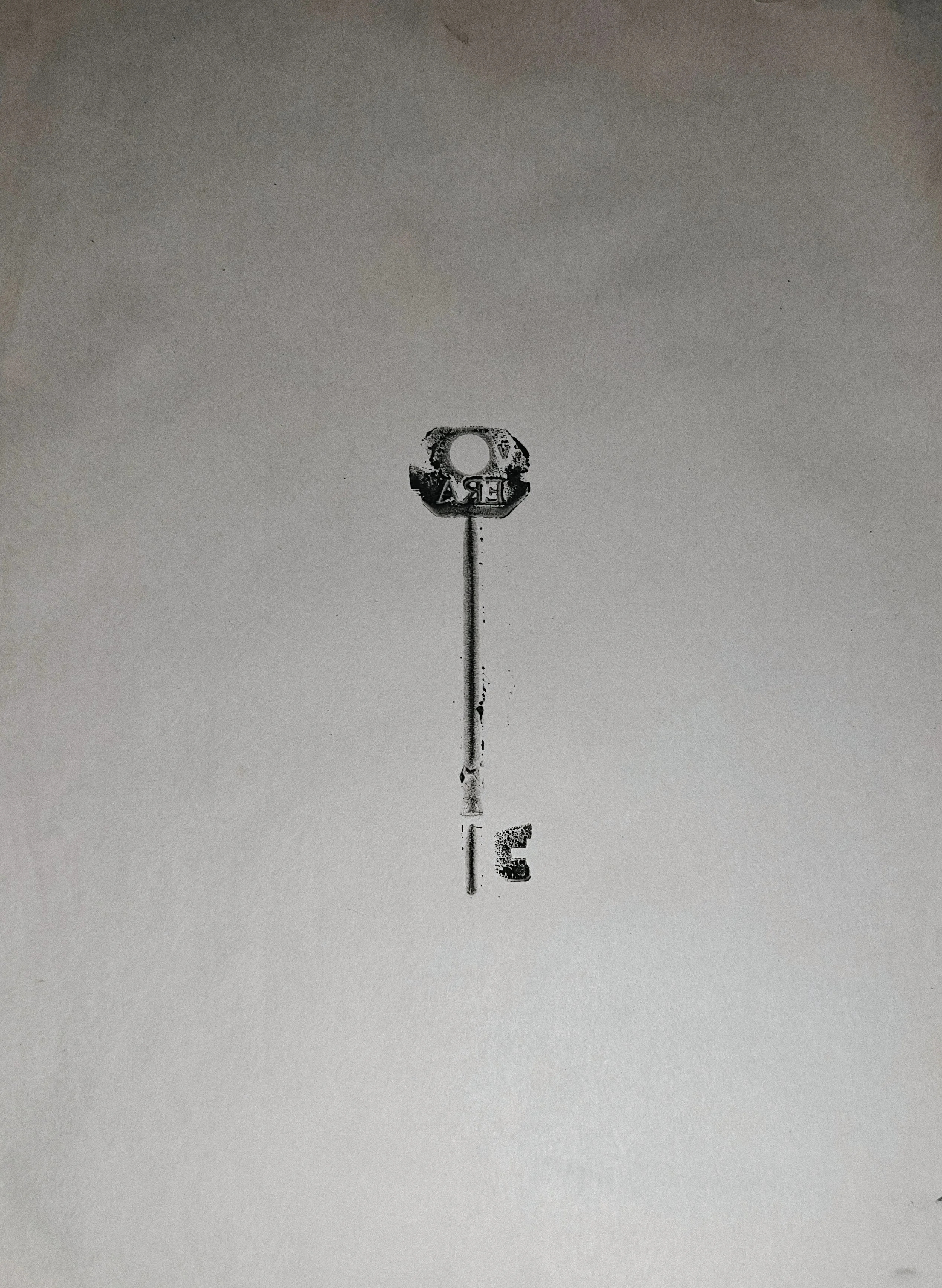 Artwork by Shaun Bell featuring a black and white print of a key.
