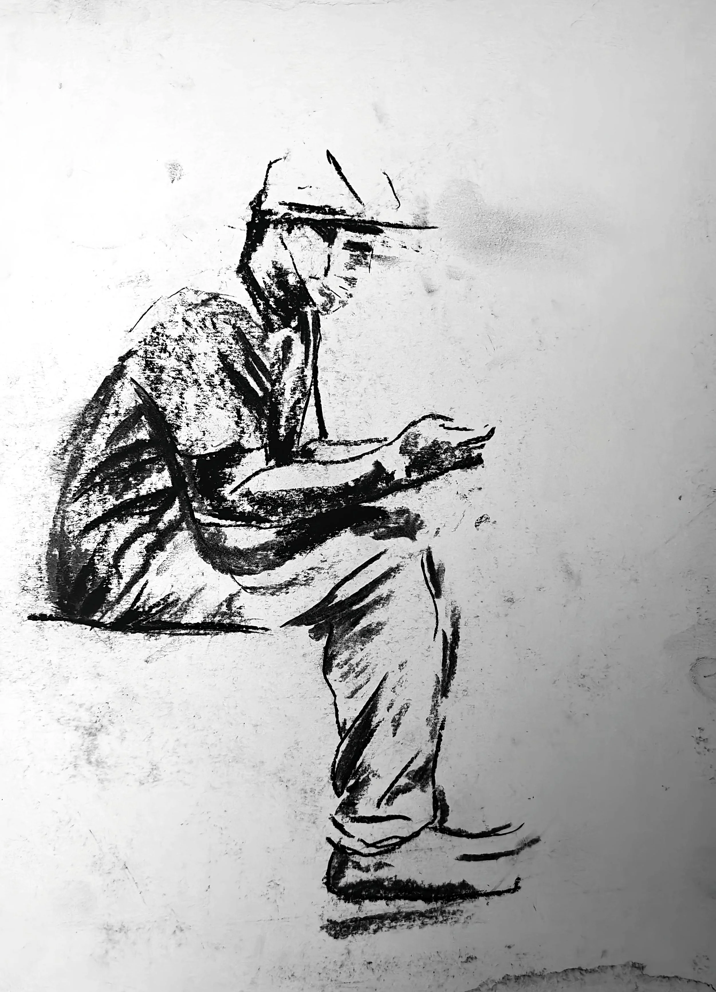 Charcoal figure drawing by Shaun Bell. Contemporary minimalist figurative artwork exploring urban isolation, anonymous city life, and human transience. Expressive tonal charcoal on paper with strong negative space and gestural mark-making.