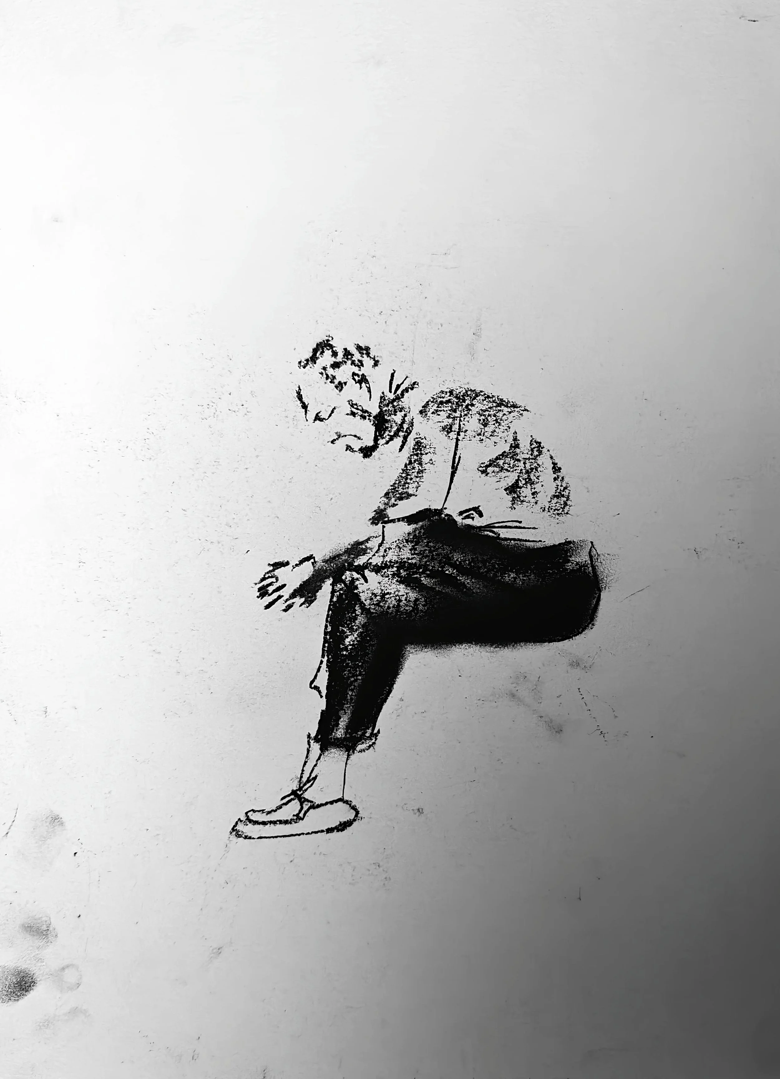 Charcoal figure drawing by Shaun Bell. Contemporary minimalist figurative artwork exploring urban isolation, anonymous city life, and human transience. Expressive tonal charcoal on paper with strong negative space and gestural mark-making.