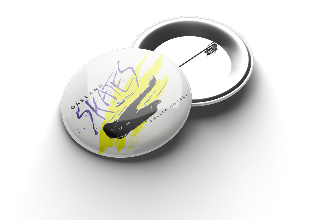 A round button pin featuring the Oakland Skates Roller Hockey team logo, with a graphic of a hockey skate and the words 'Oakland Skates' and 'Roller Hockey' on it.
