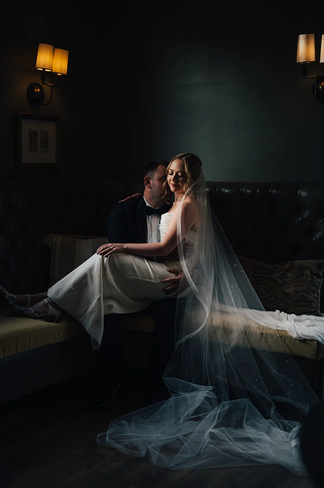 Laurie’s customers, Fernando and Kate embracing by the lake on their wedding day.