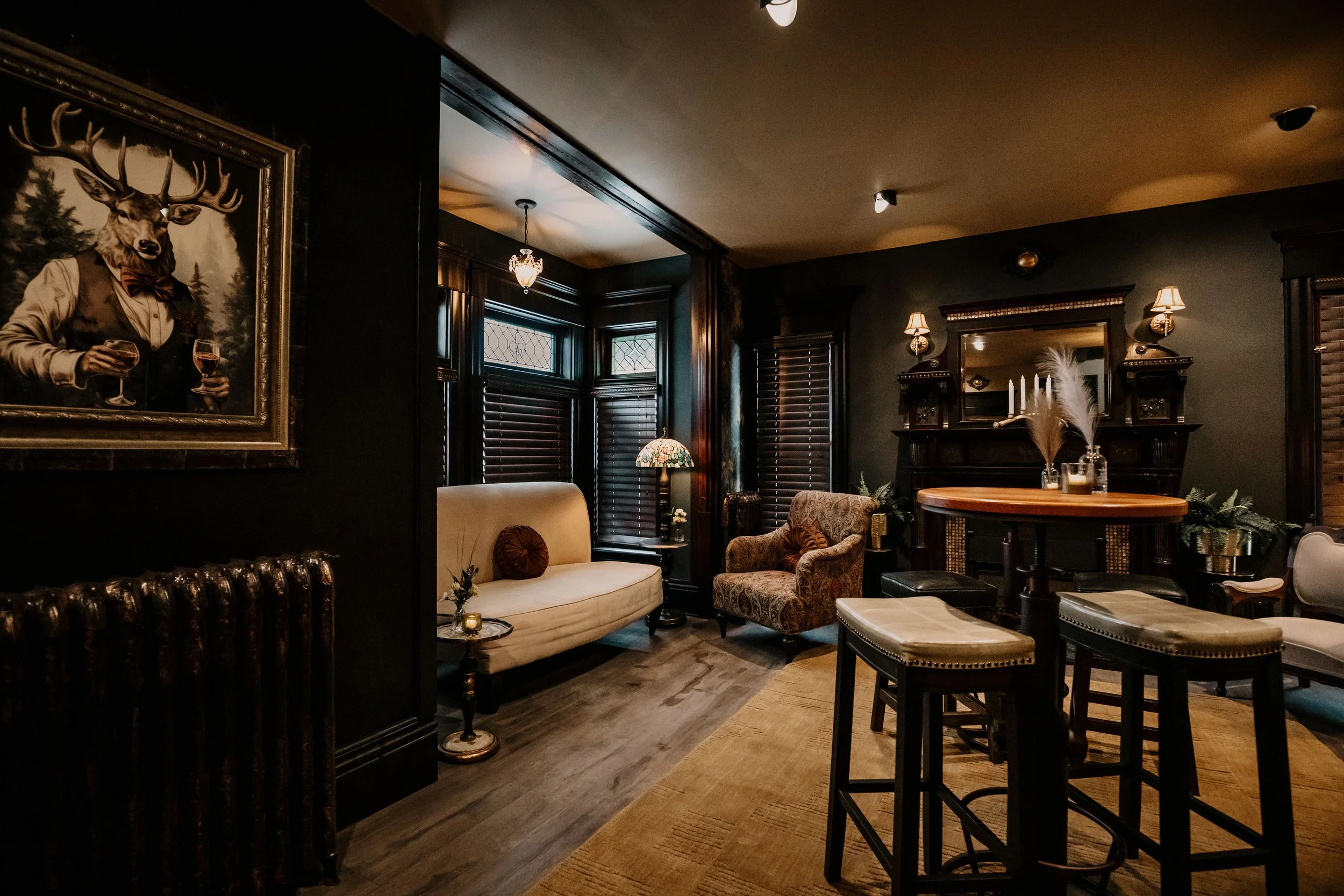 Interior lounge view with bar seating and vintage decor at Sir Sanford Loft On Main in Collingwood