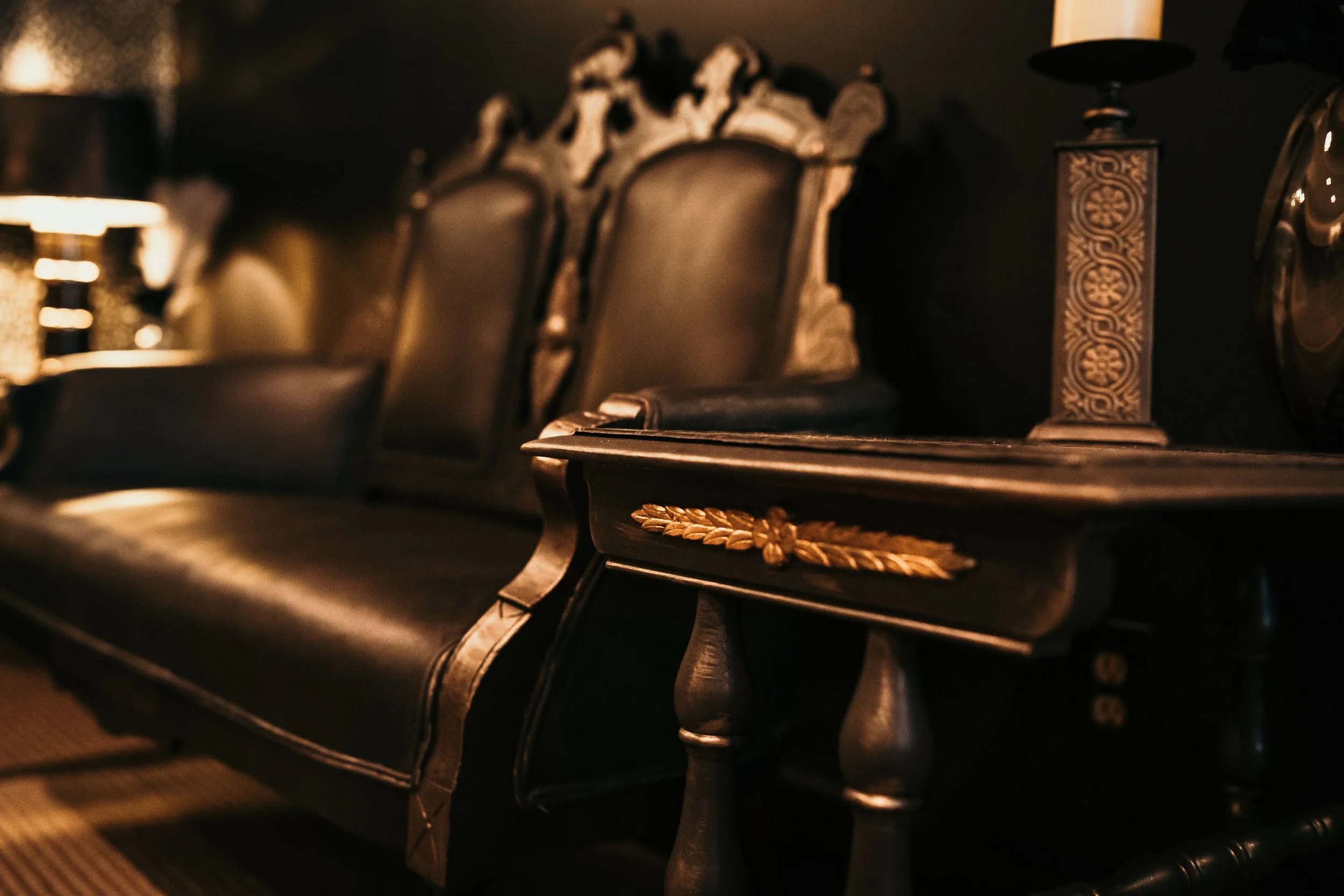 Vintage leather seating and woodwork detail in lounge area at Sir Sanford Loft On Main in Collingwood