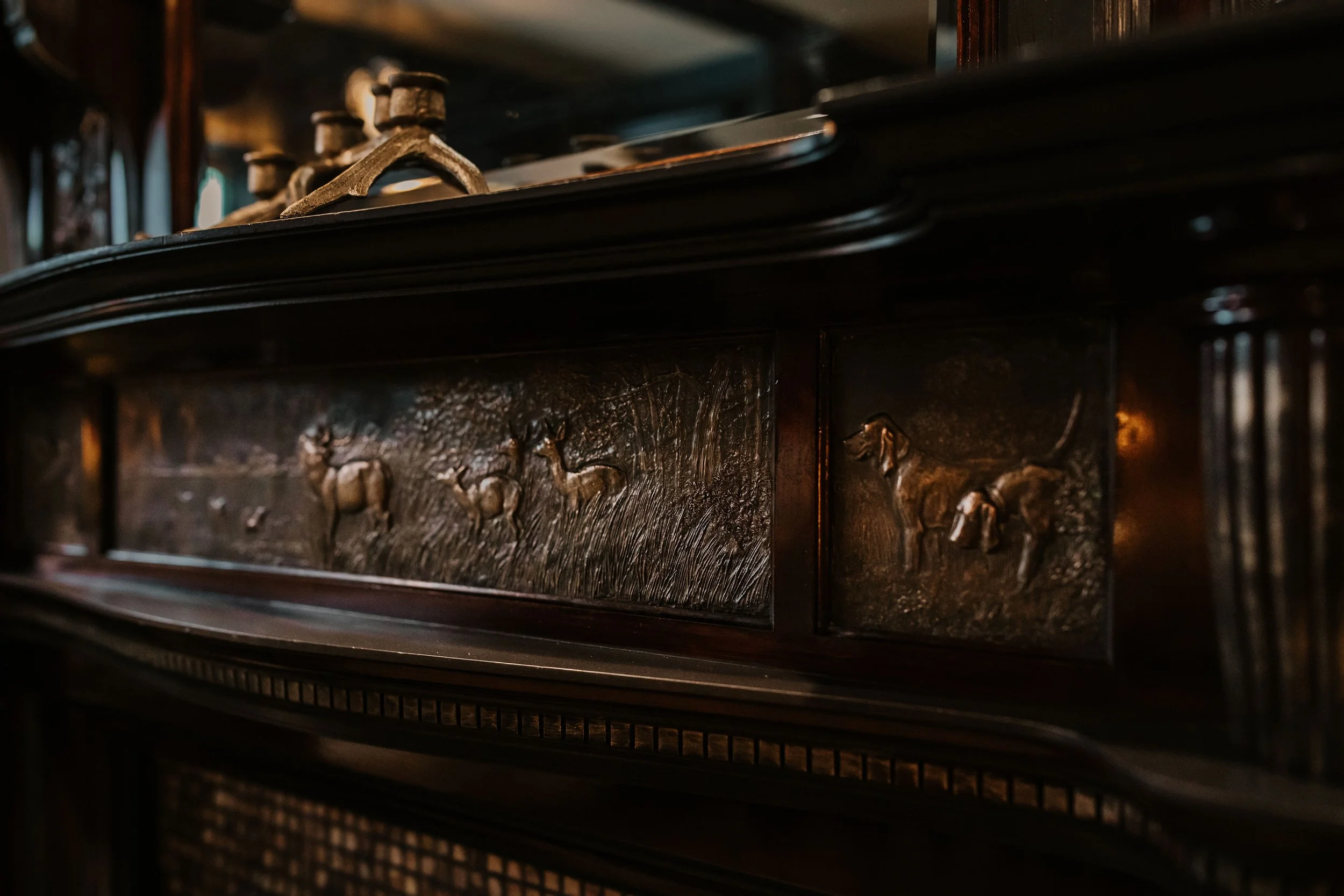 Ornate wood detailing and vintage craftsmanship inside Sir Sanford Loft On Main in Collingwood