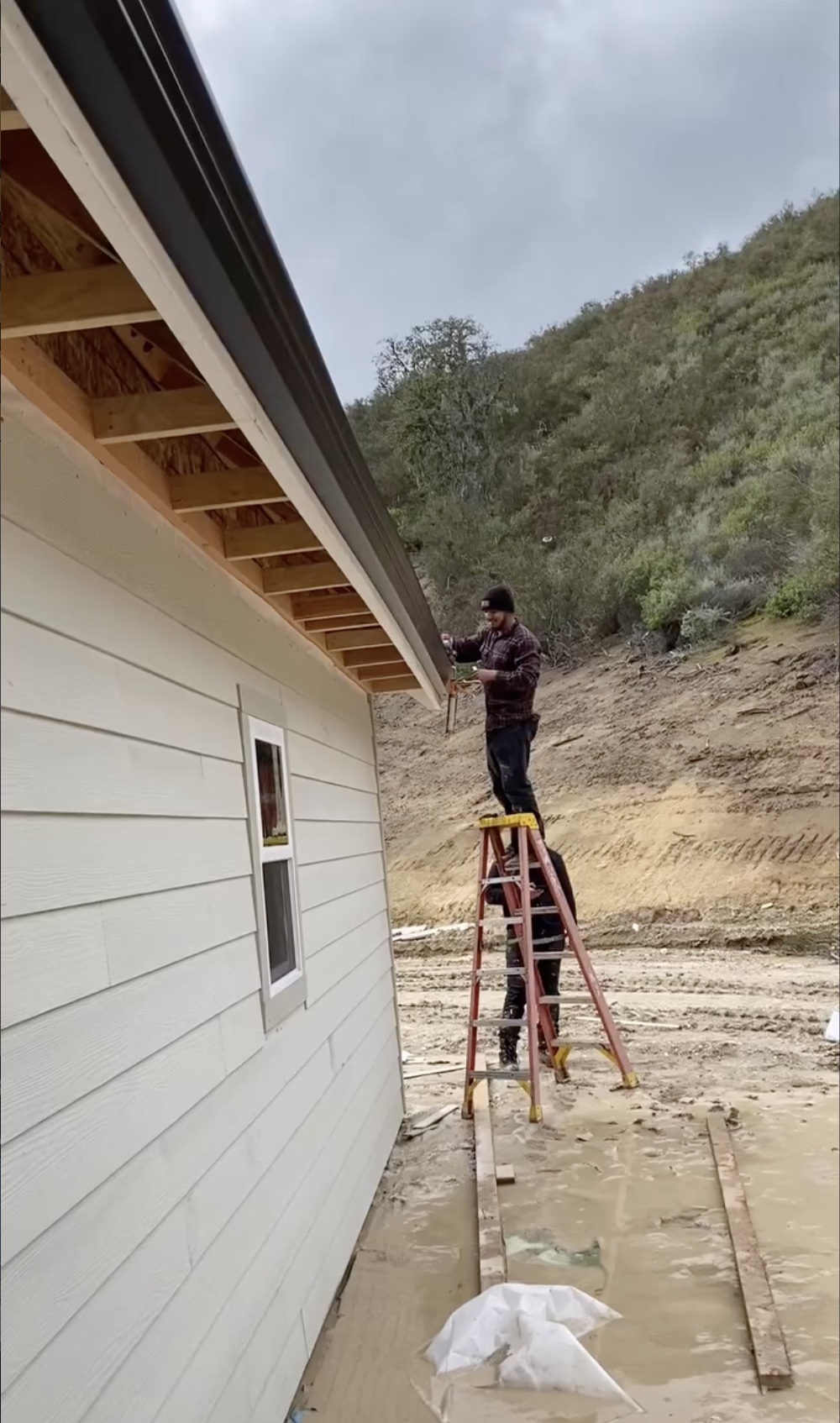 workers in process of a new gutter Install in Gilroy, CA.