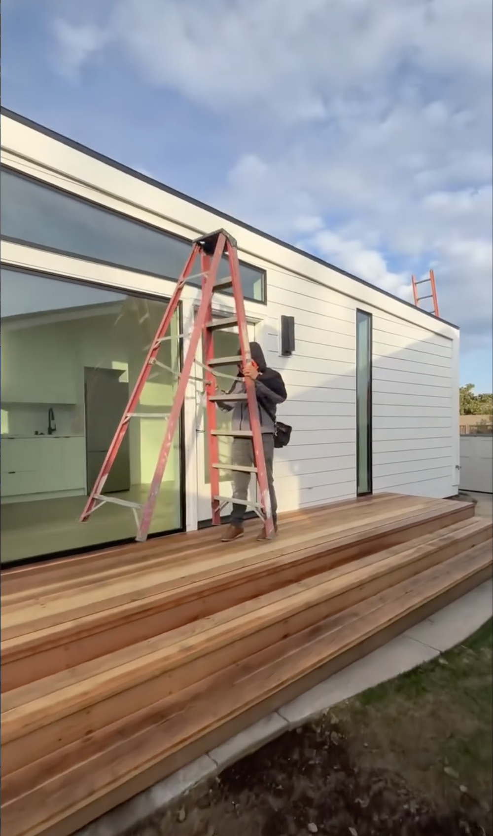 Person working on a house exterior remodel in Morgan Hill, CA. 