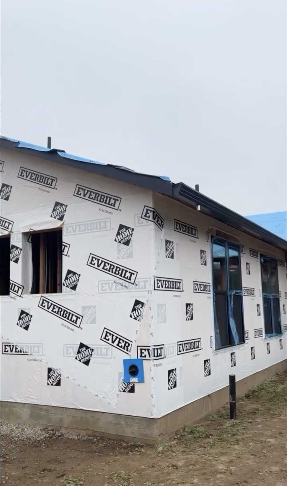 Exterior of a house under construction with new flashing and gutters in Santa Cruz, CA. 