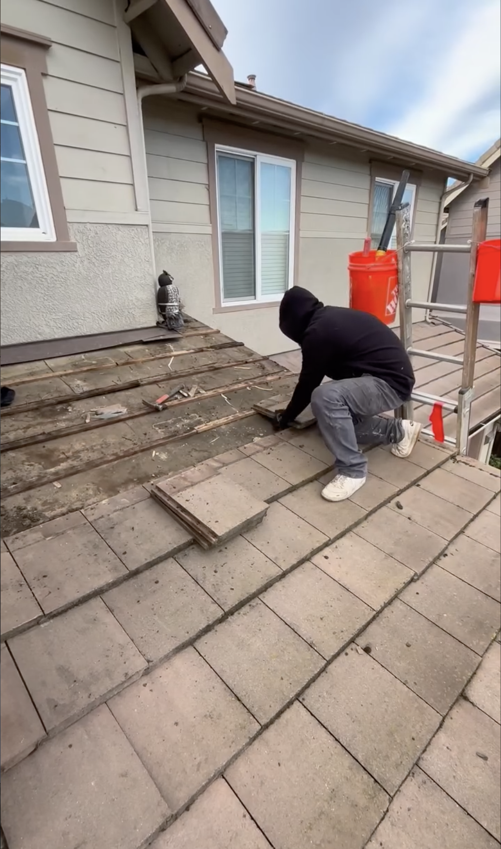 Replacing roof tiles on a house in San Benito County. 