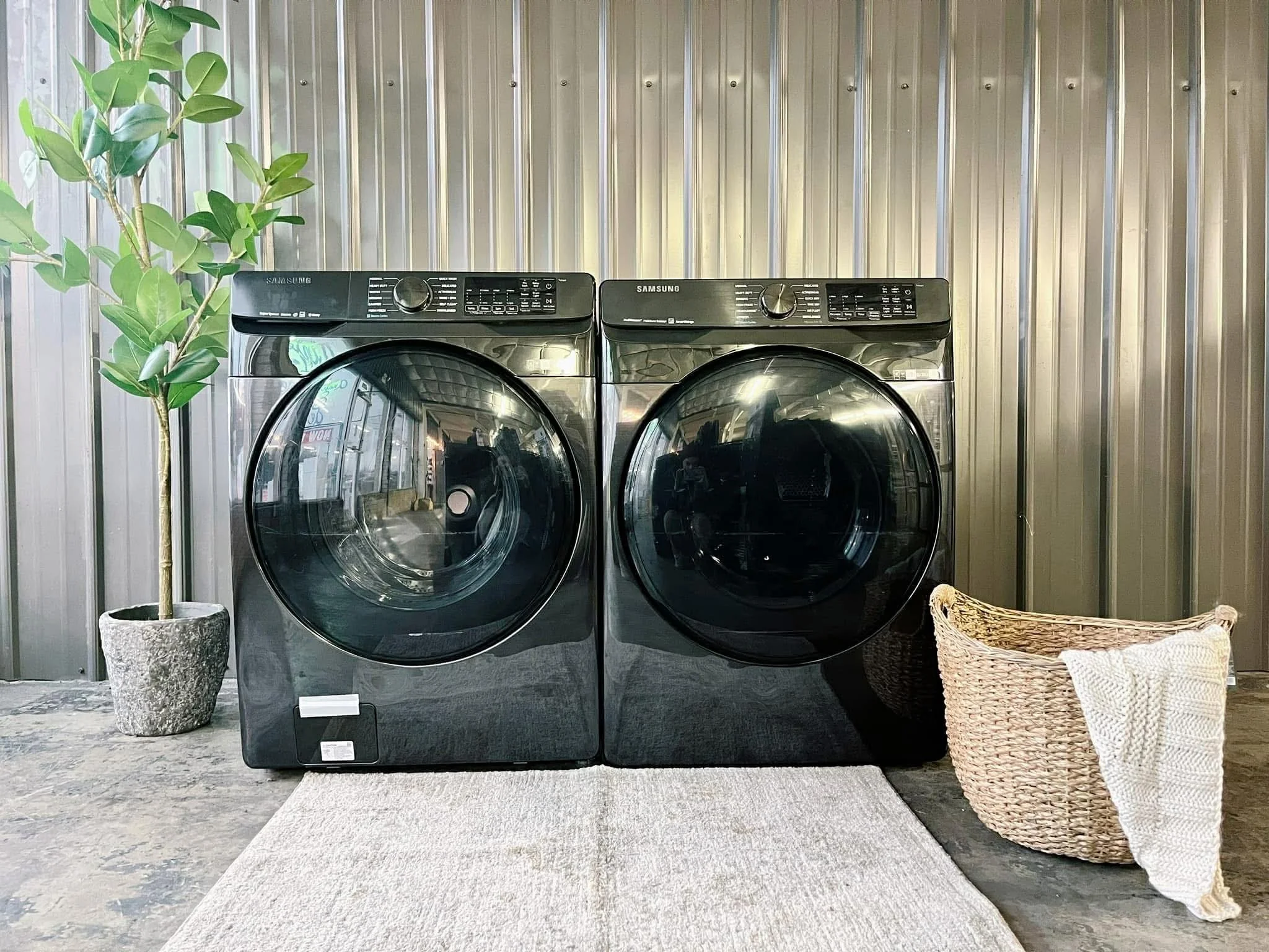 Samsung front load black washer dryer set on clearance in a huntsville, alabama showroom