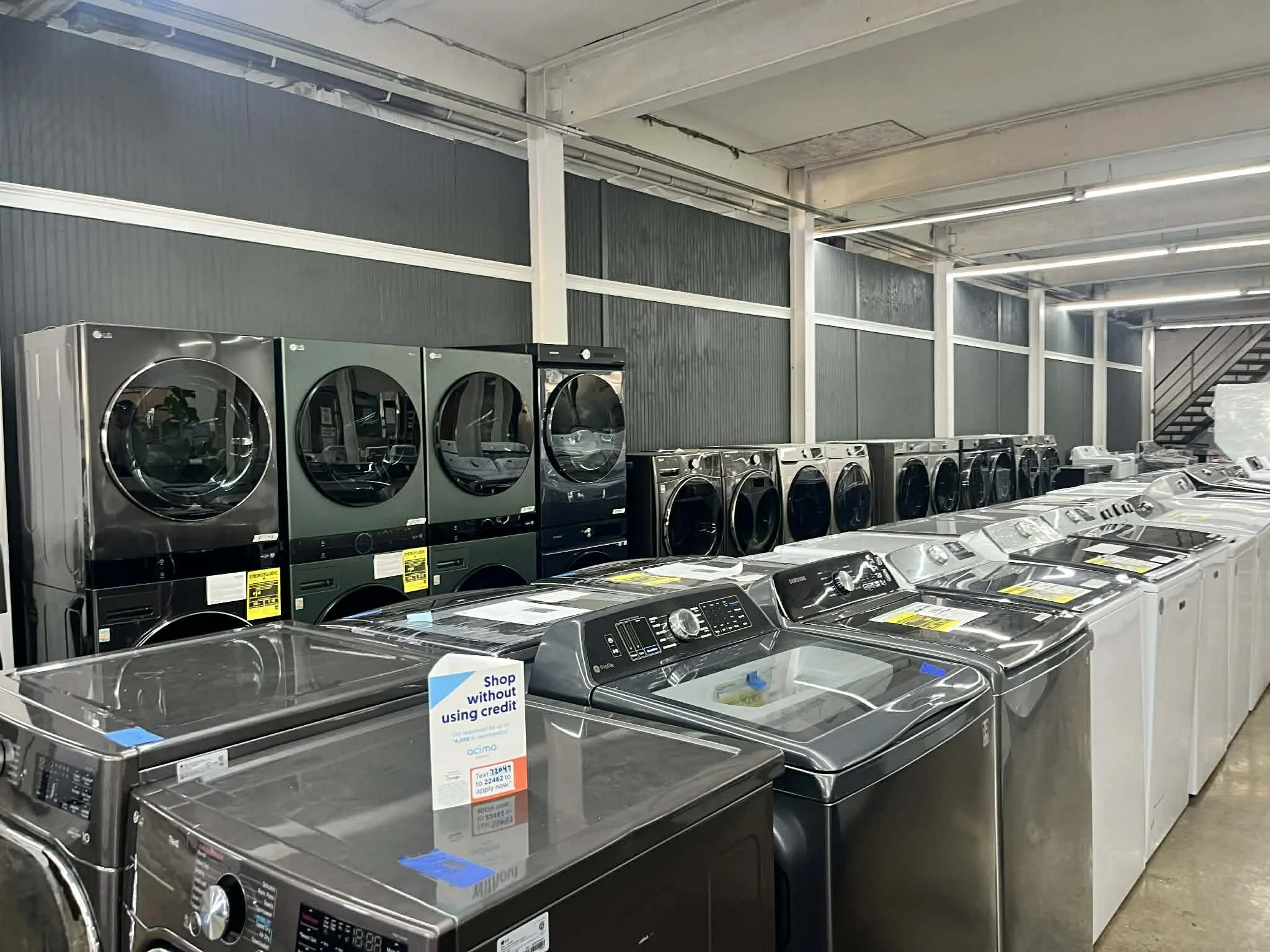 lots of washers and dryer sets on sale in a huntsville alabama showroom on clearance