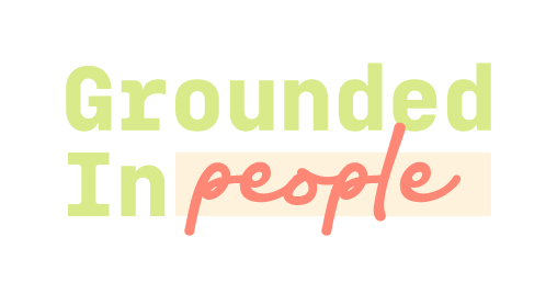 Text reading 'Grounded In people' with 'Grounded In' in light green and 'people' in coral pink.