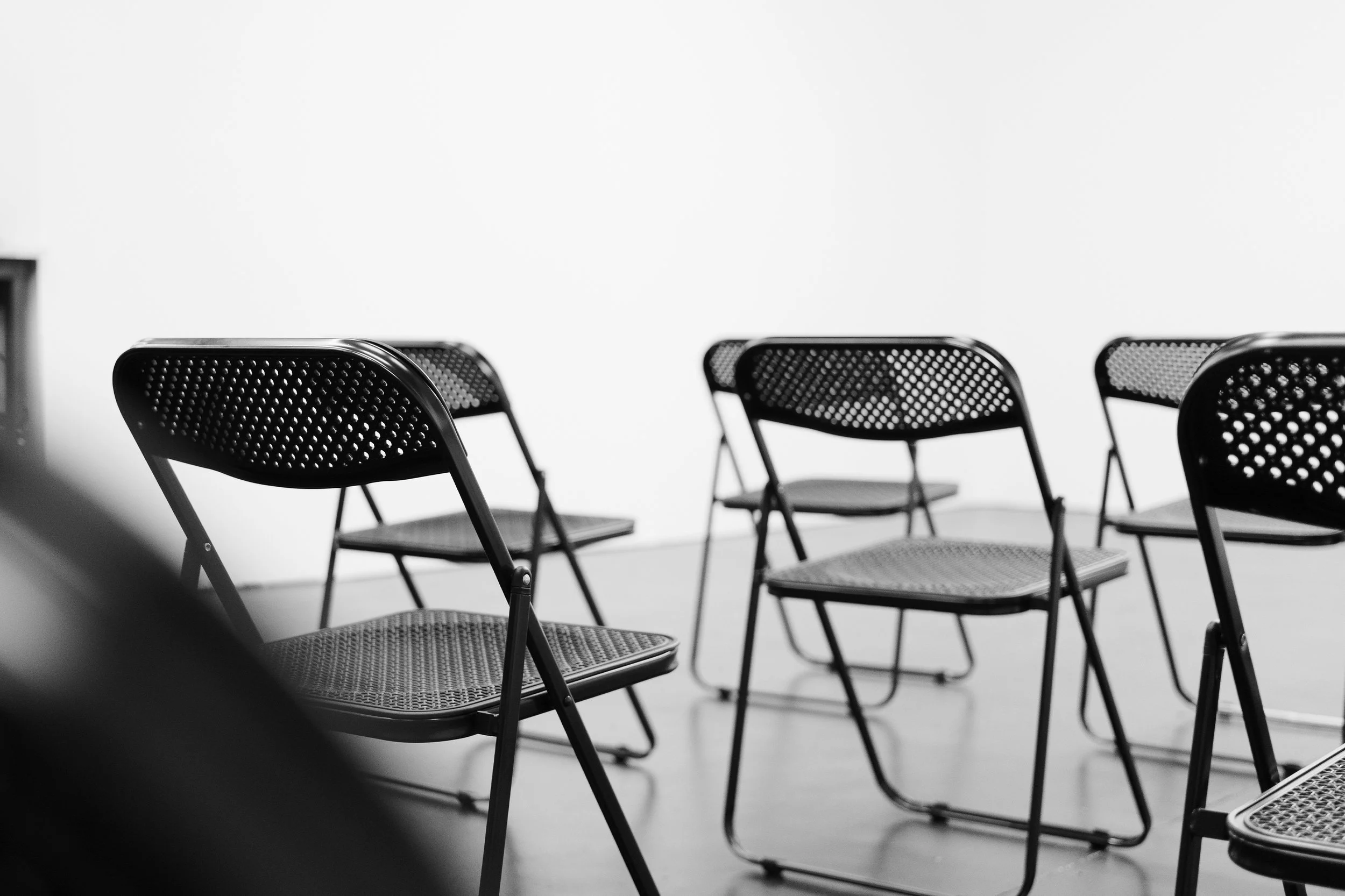 Folding chairs arranged for guests in the studio venue.