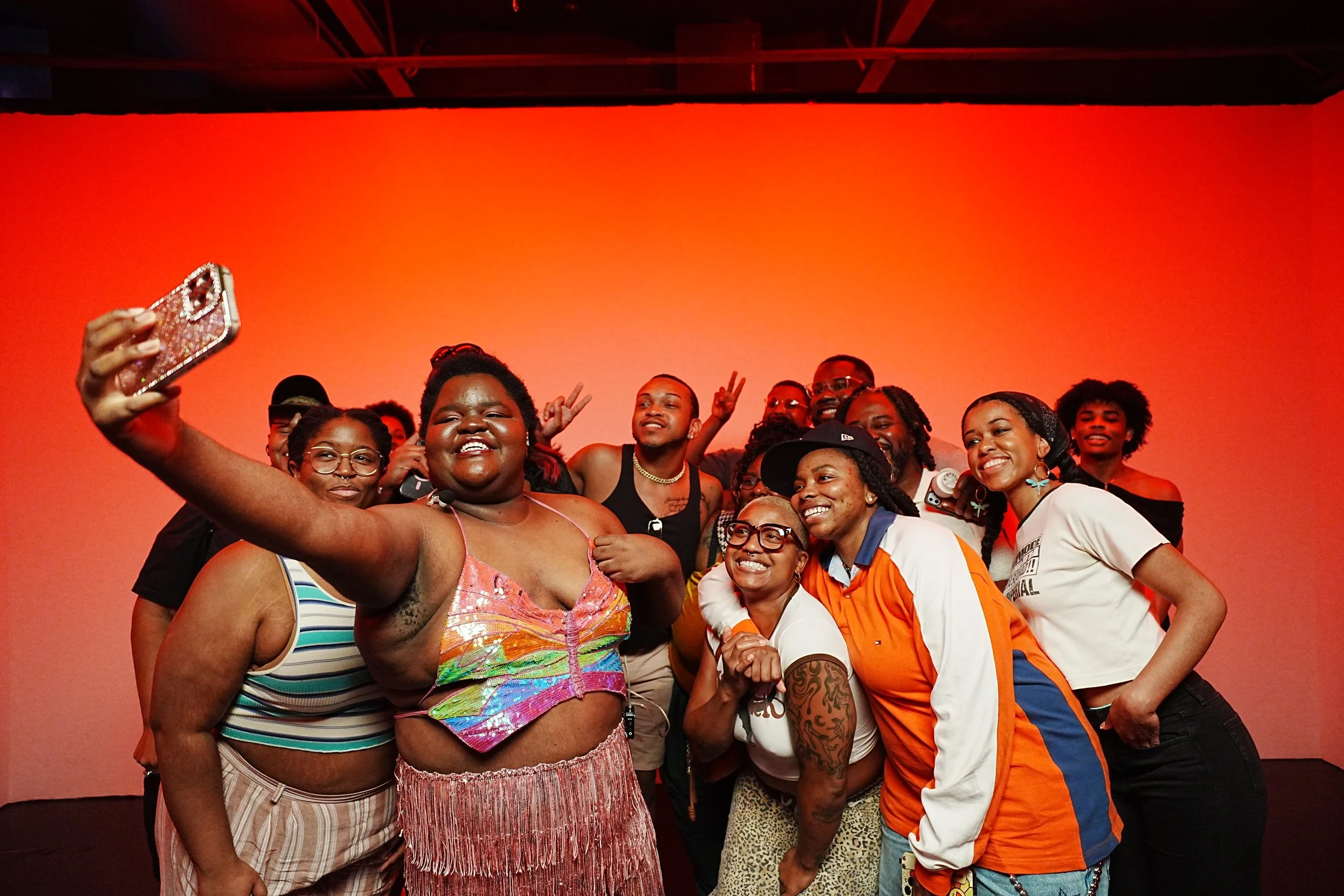 Guests taking a group photo at an OVASEA Studios event.