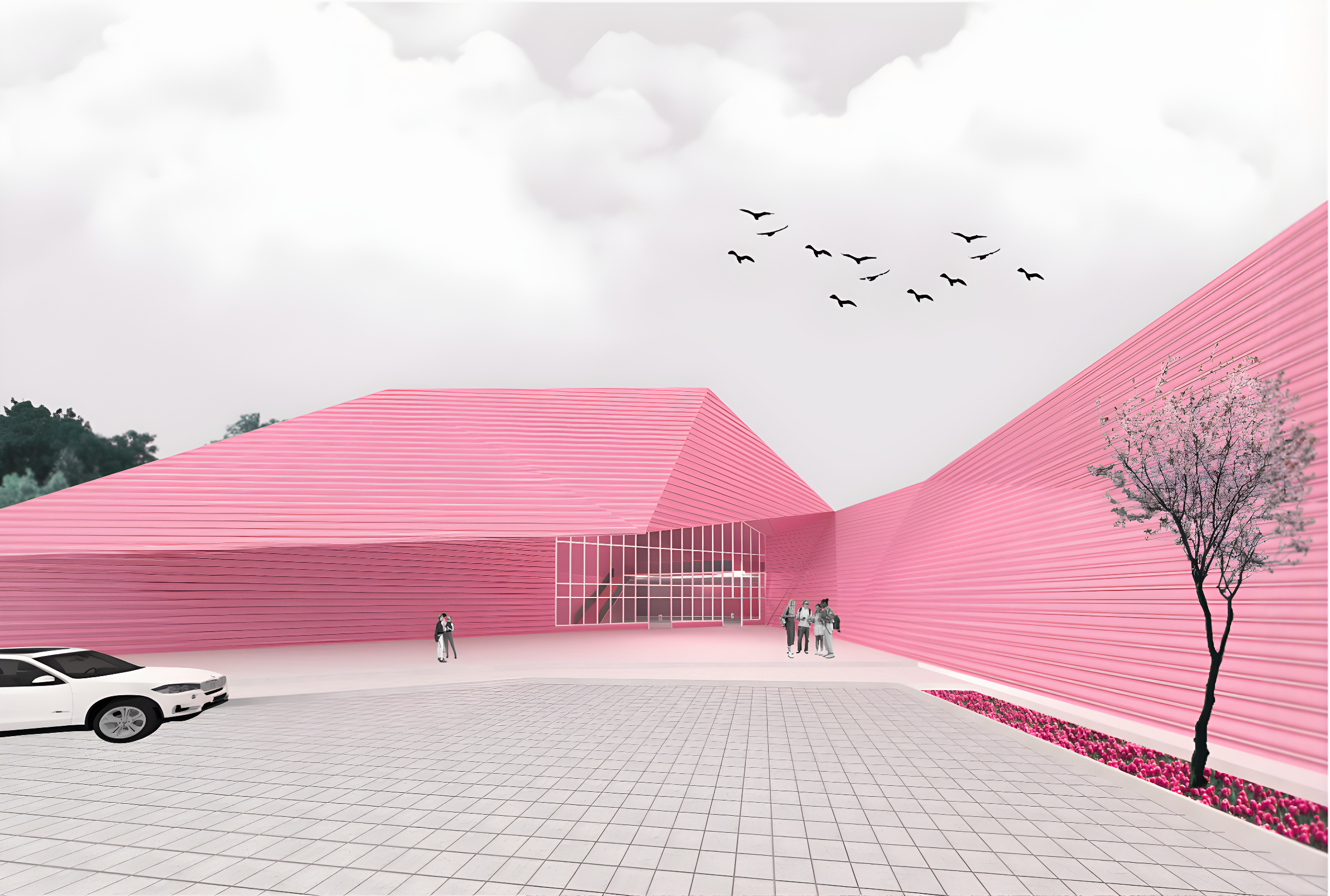 Modern pink architectural building with large glass entrance, surrounded by a tiled plaza, a white car parked in the foreground, and a few people near the entrance. There is a pink flowering tree on the right and a flock of birds in the cloudy sky.