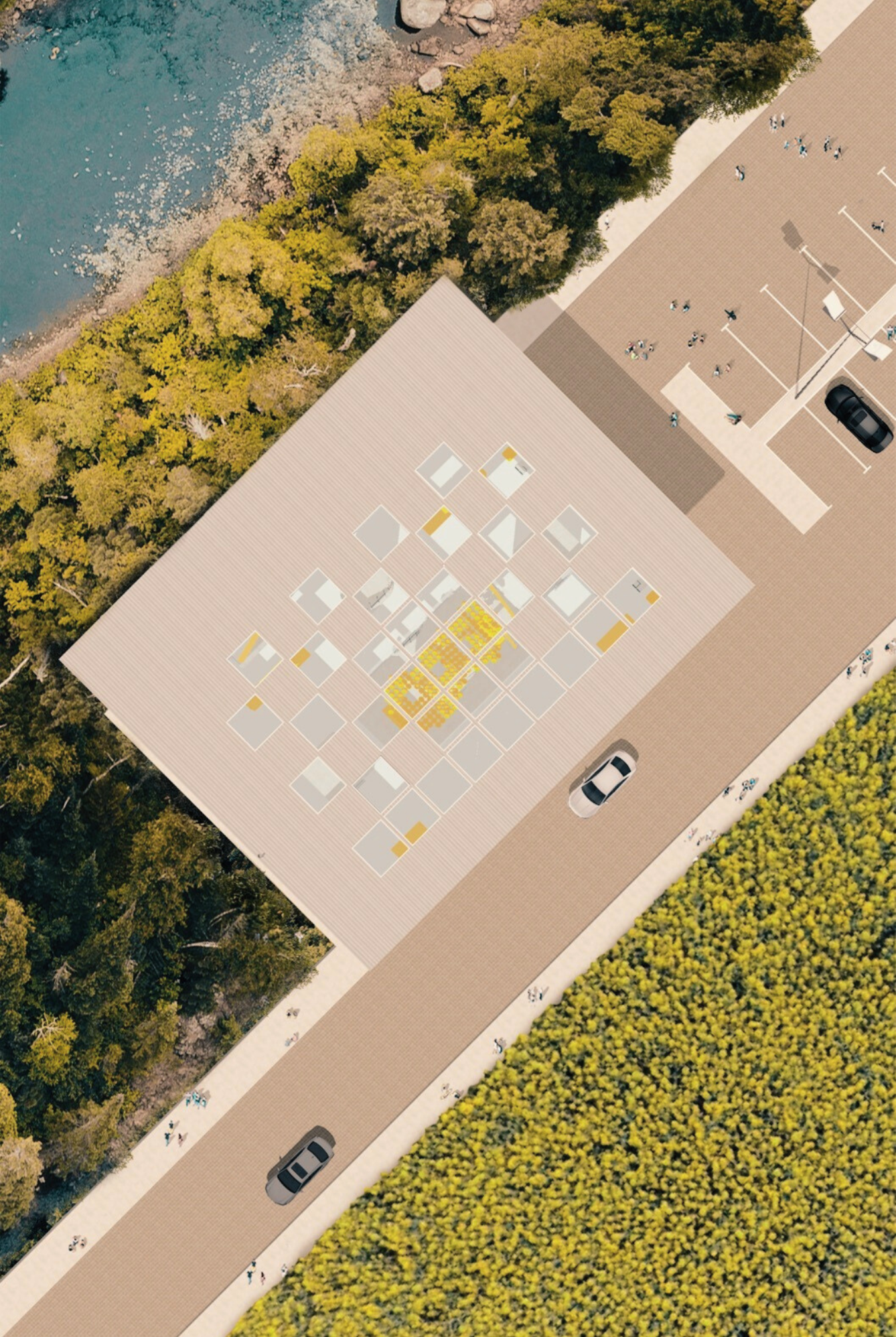 Aerial view of a building with a rooftop design featuring square transparent sections and yellow accents, adjacent to a parking lot with a few cars and a playground, surrounded by green trees and a body of water.