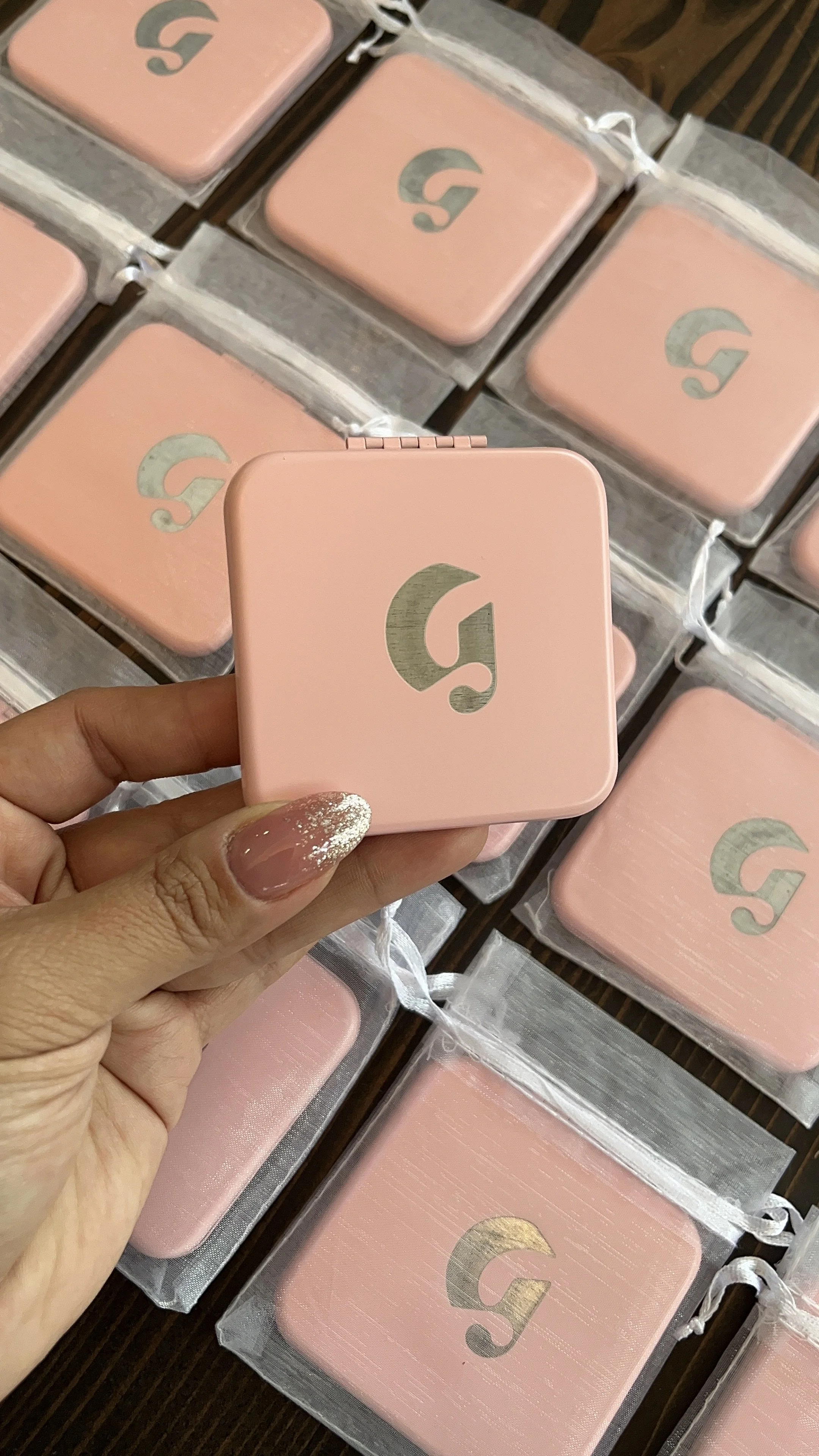 laser engraved "G" on compact mirrors